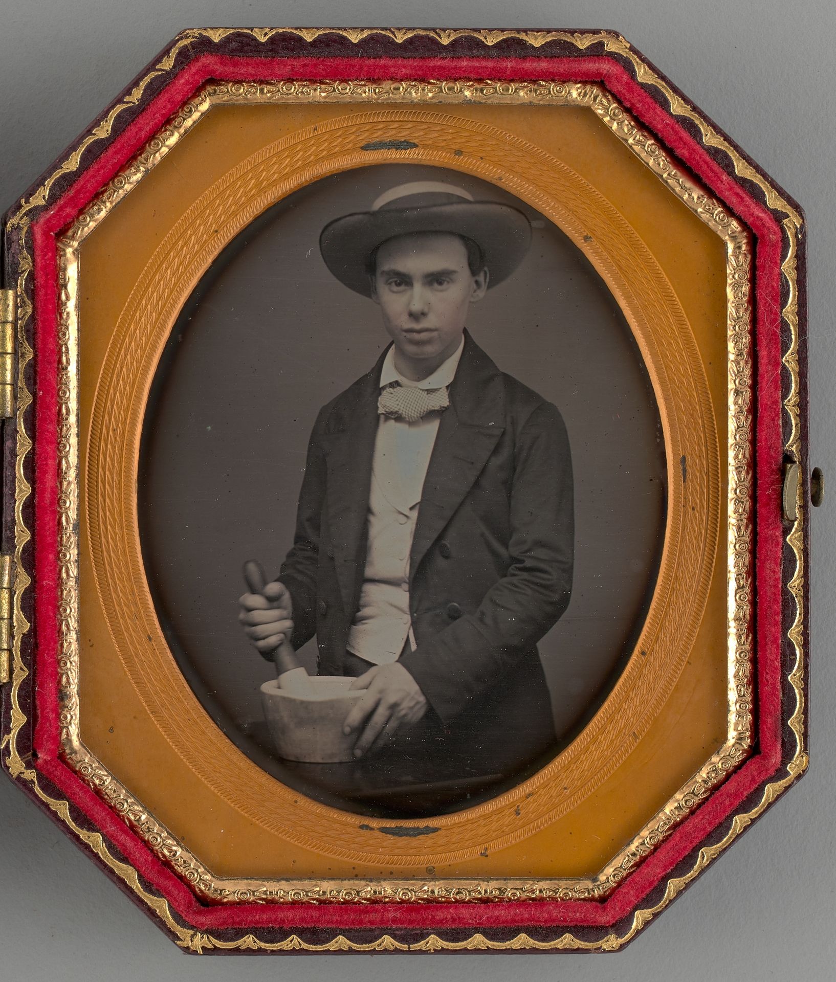 Untitled (Portrait of a Boy Holding a Mortar) by Anonymous
