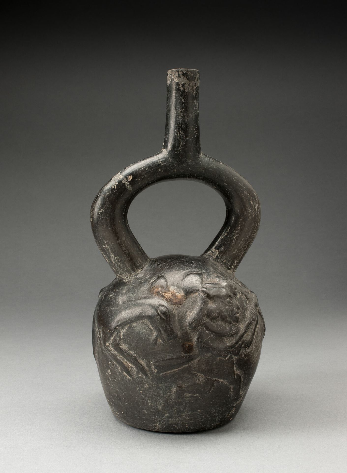 Stirrup Spout Vessel with Raised Deer Hunt Motifs by Moche