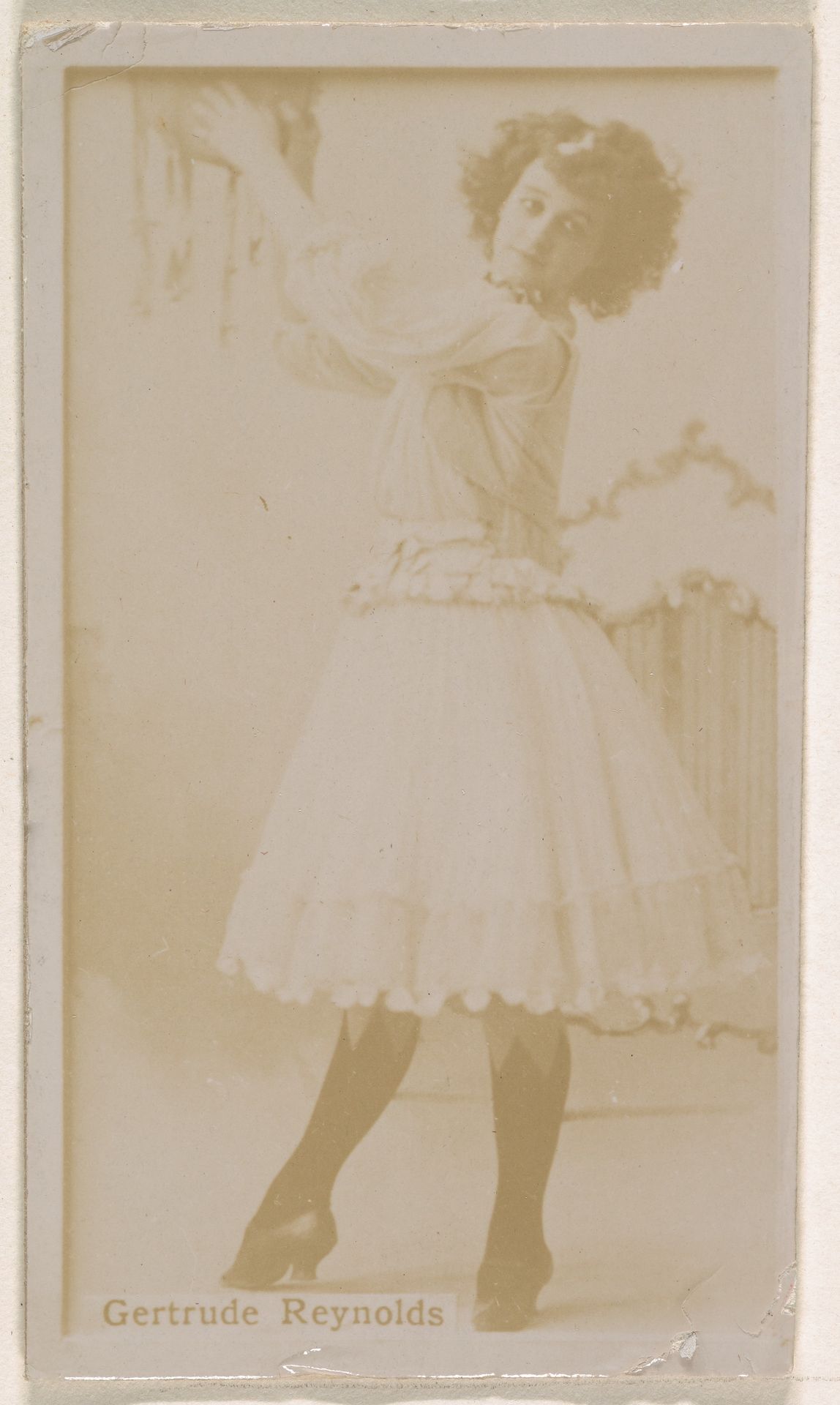 Gertrude Reynolds, from the Actresses series (N245) issued by Kinney Brothers to promote Sweet Caporal Cigarettes by Kinney Brothers Tobacco Company