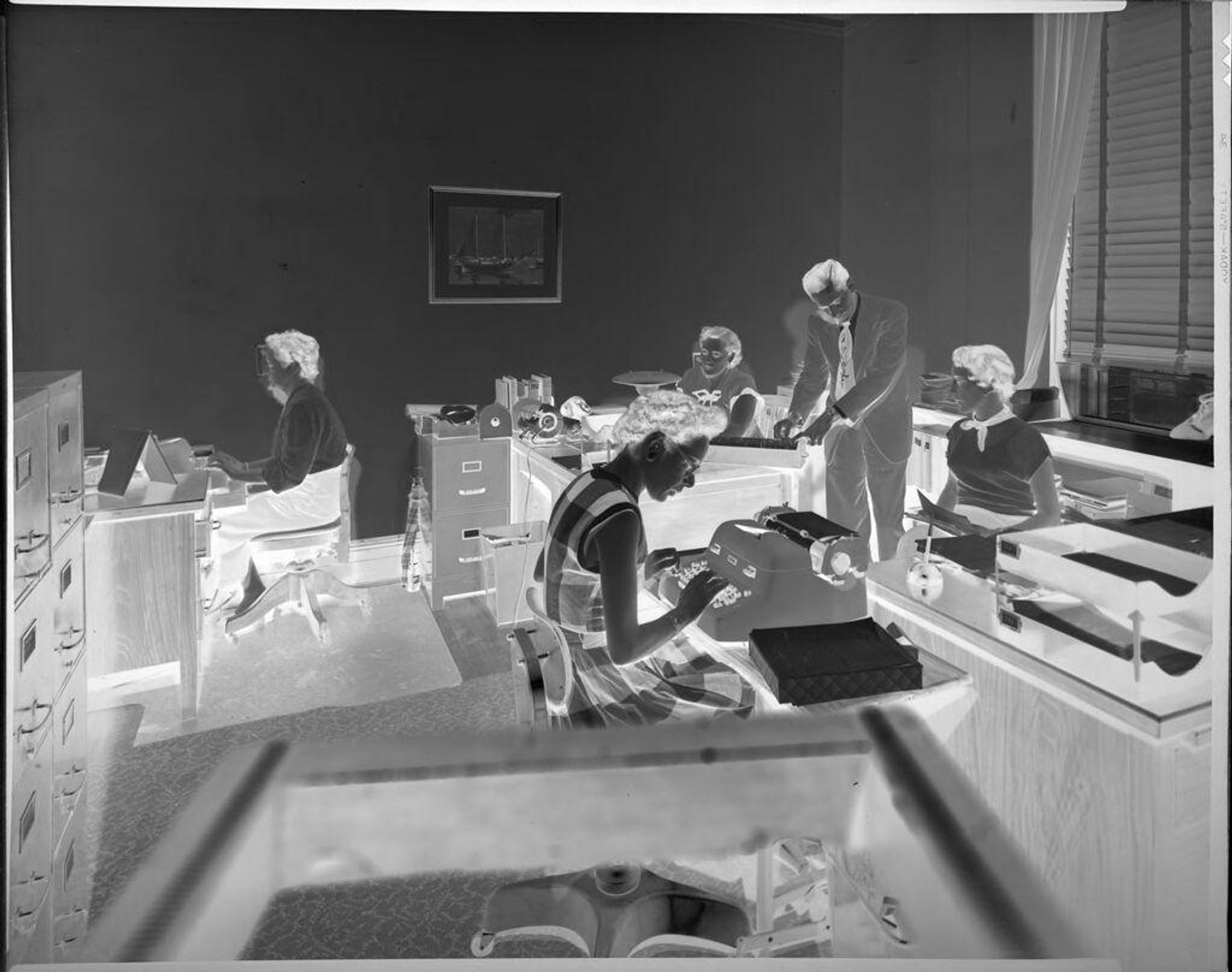 Untitled (office workers, typewriter) by Harris & Ewing