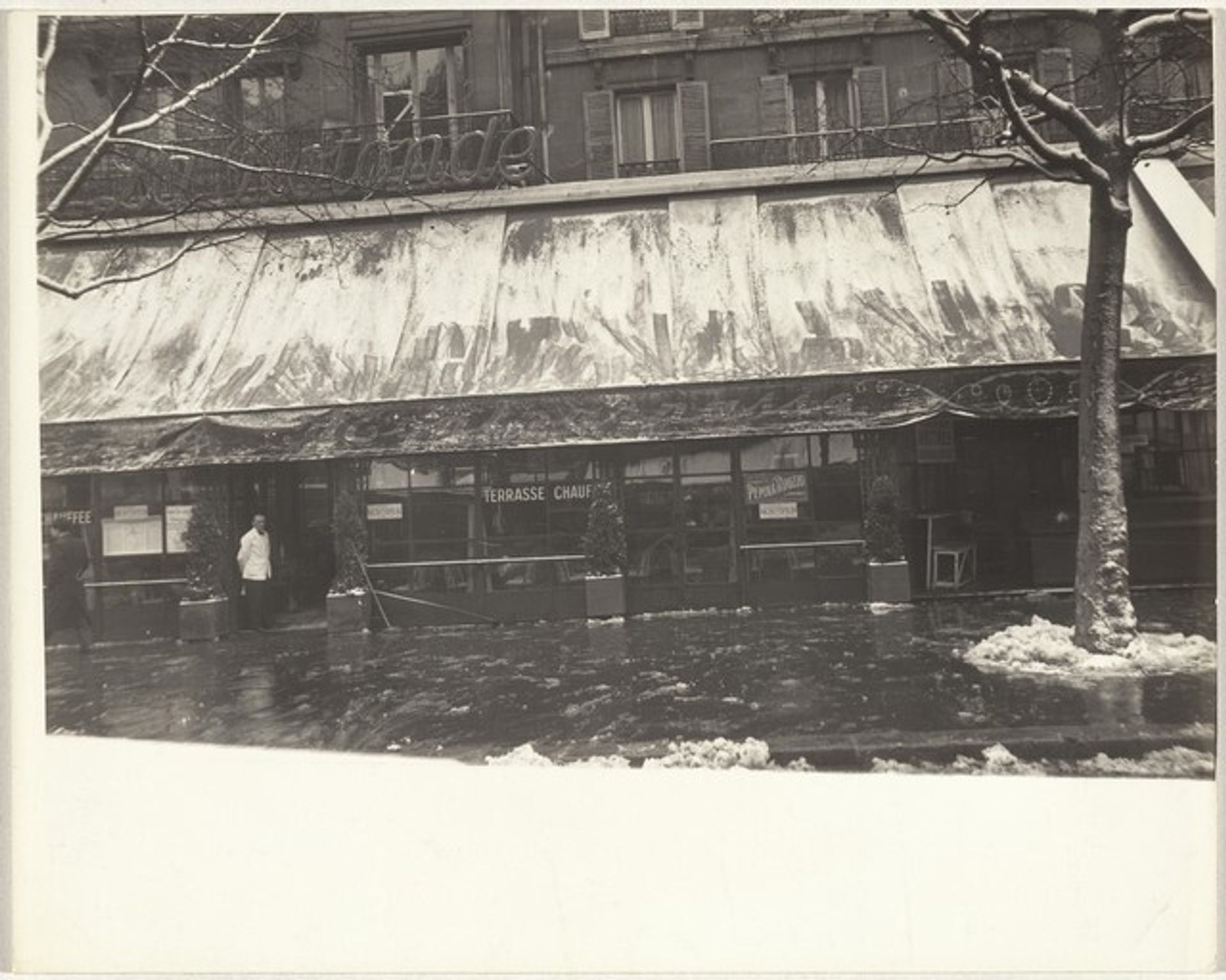 Café front in snow, Paris by Robert Frank