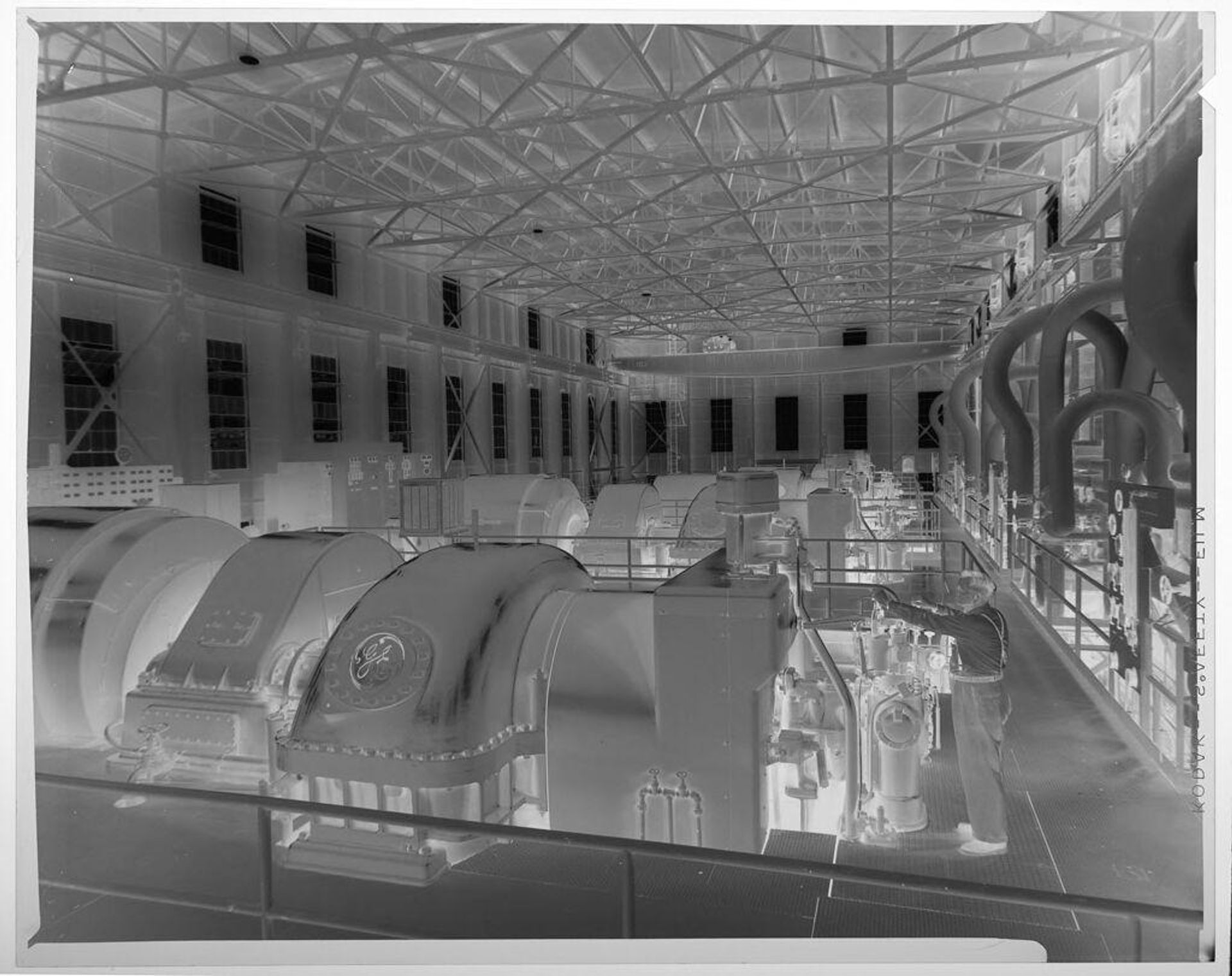 Untitled (man with large machines inside GE factory) by Jack Gould