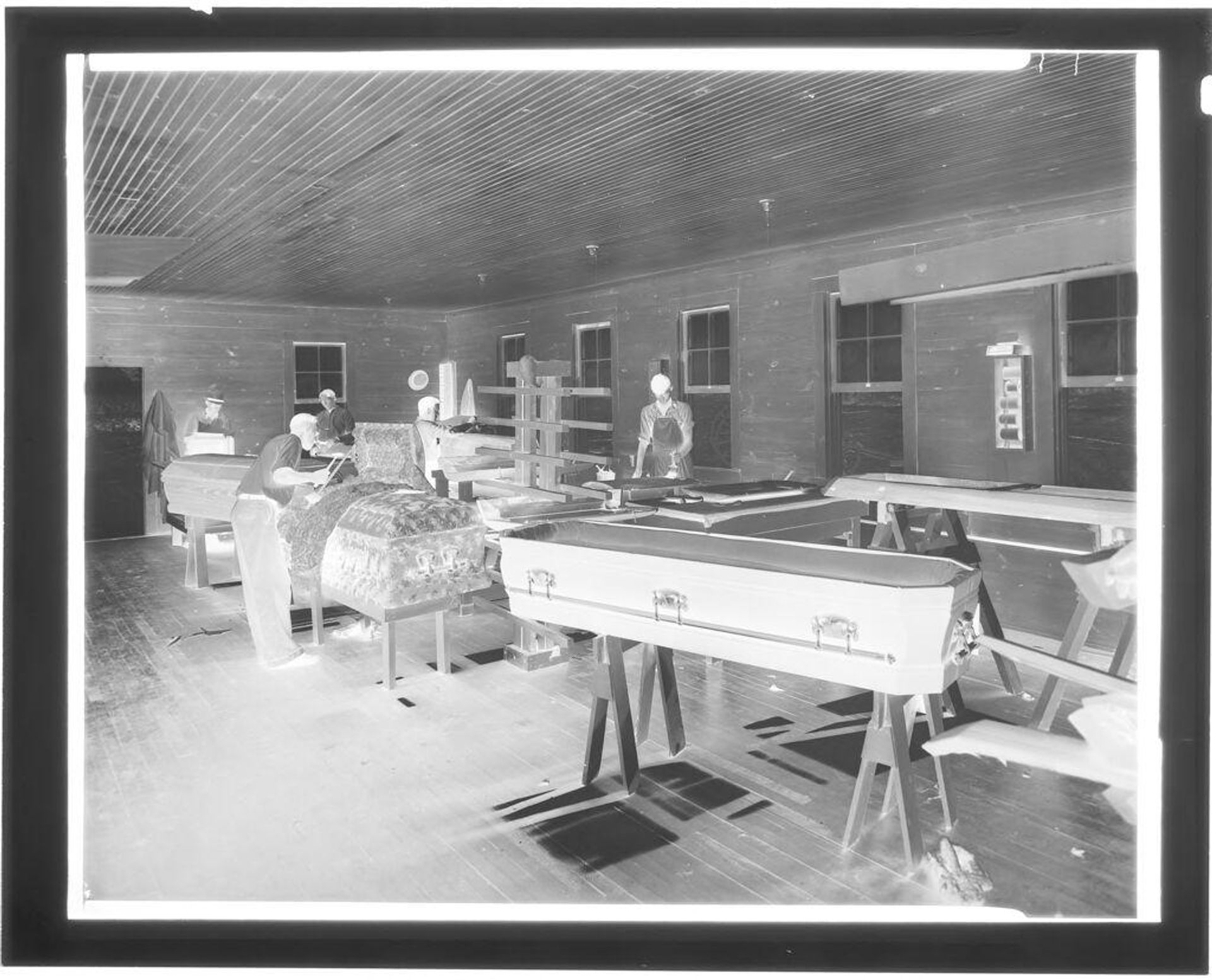 Untitled (craftsmen working at Woodward Casket Co.) by Hamblin Studio