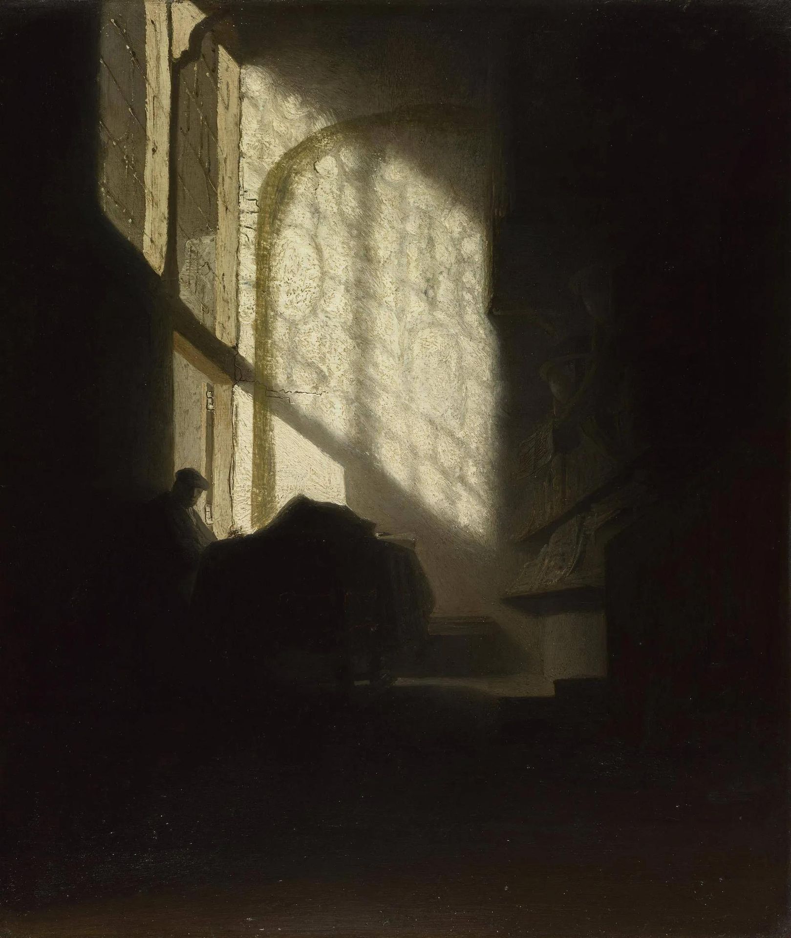 A Man seated reading at a Table in a Lofty Room by Rembrandt van Rijn