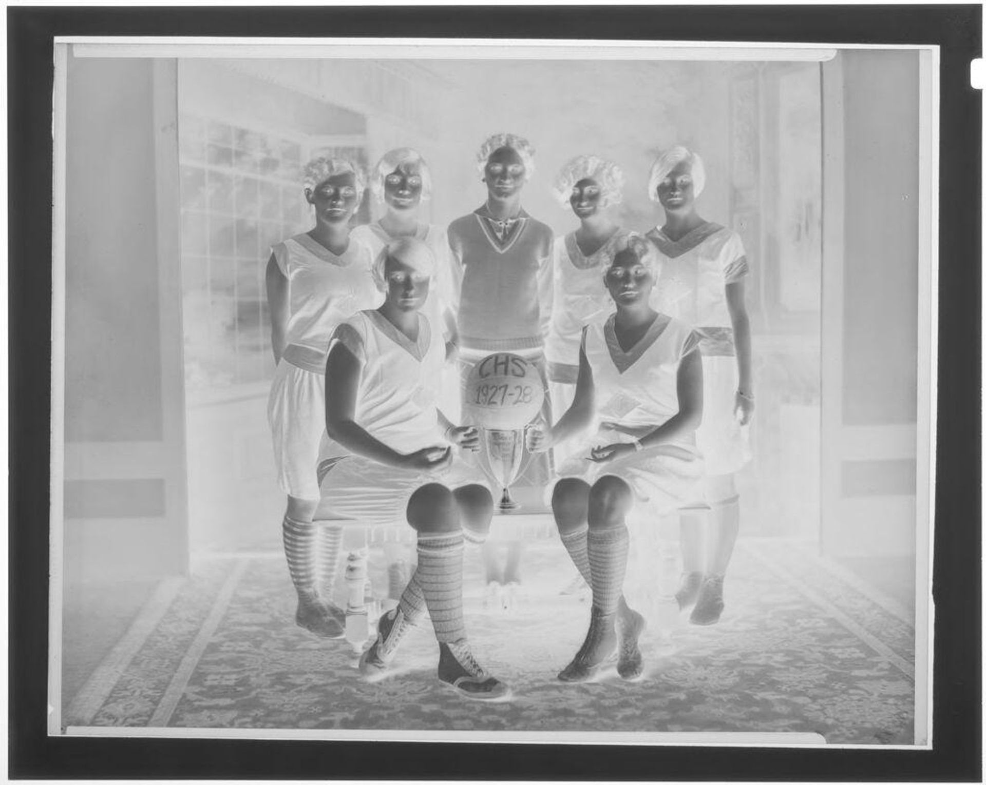 Untitled (girl's highschool basketball team posing with trophy) by Hamblin Studio