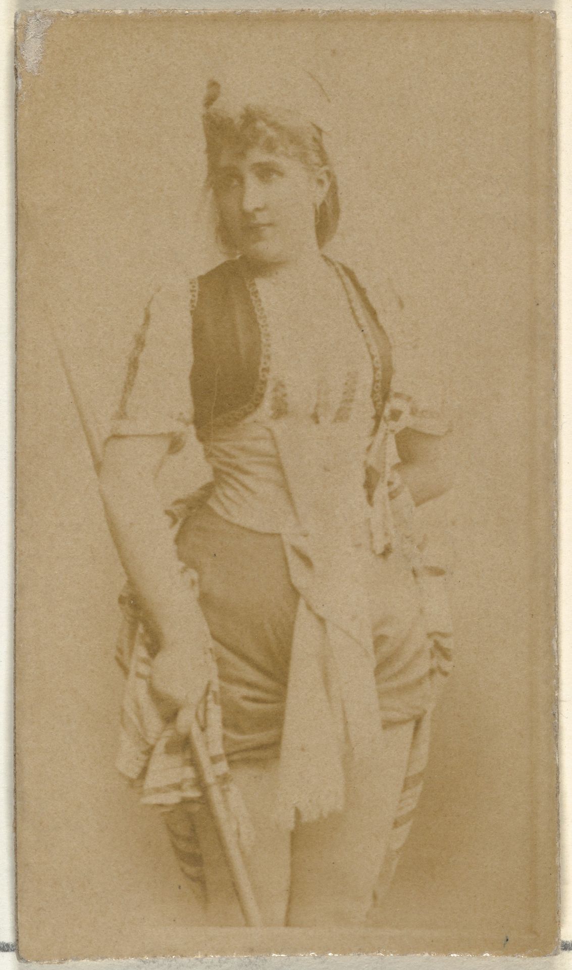 [Actress holding wooden cane], from the Actors and Actresses series (N145-8) issued by Duke Sons & Co. to promote Duke Cigarettes by W. Duke, Sons & Co.