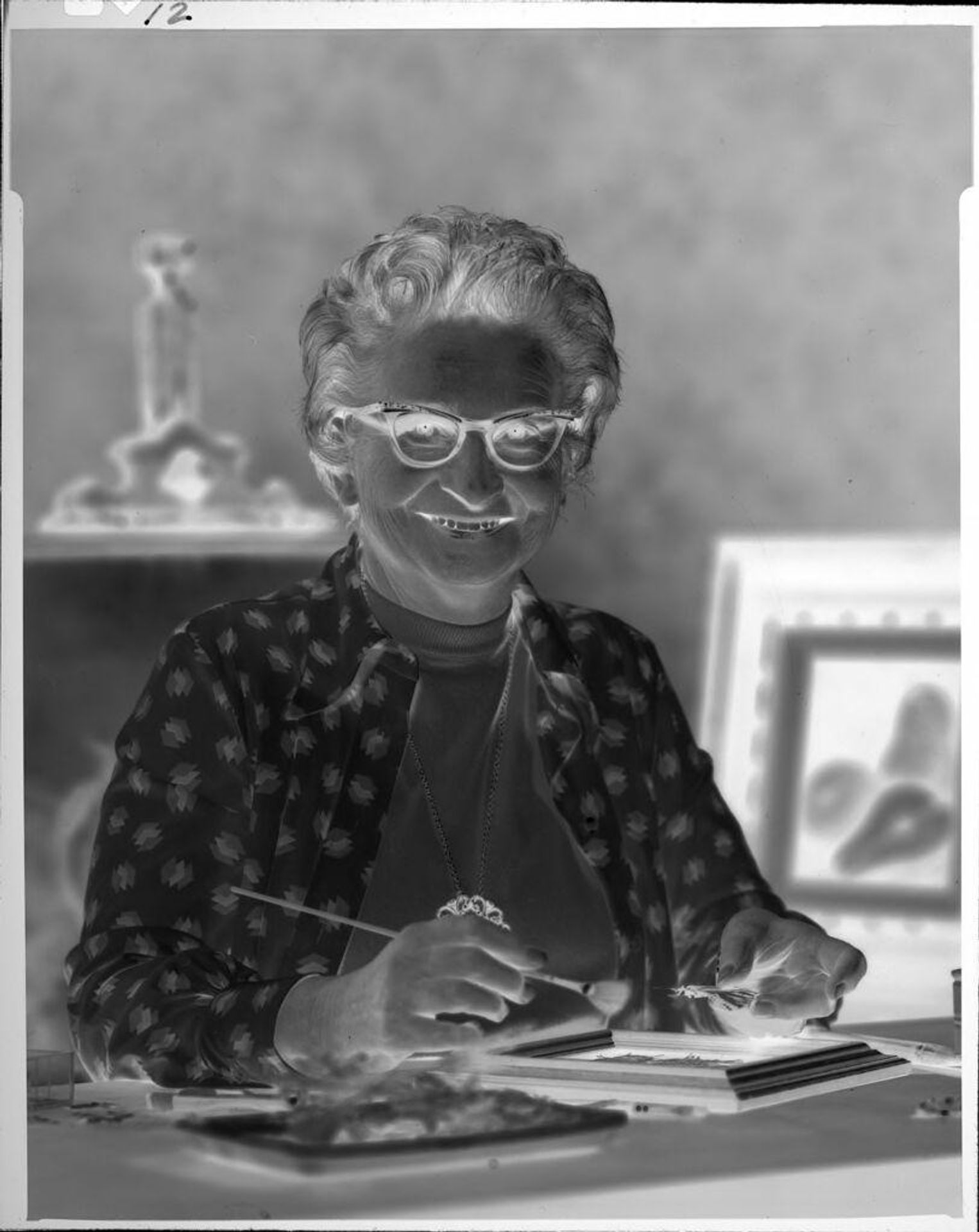 Untitled (woman with paintbrush and butterfly) by Ken Whitmire Associates