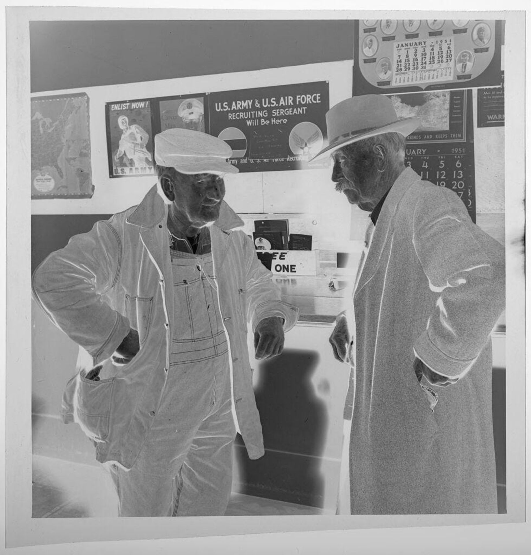 Untitled (two men standing and talking in post office) by Jack Gould