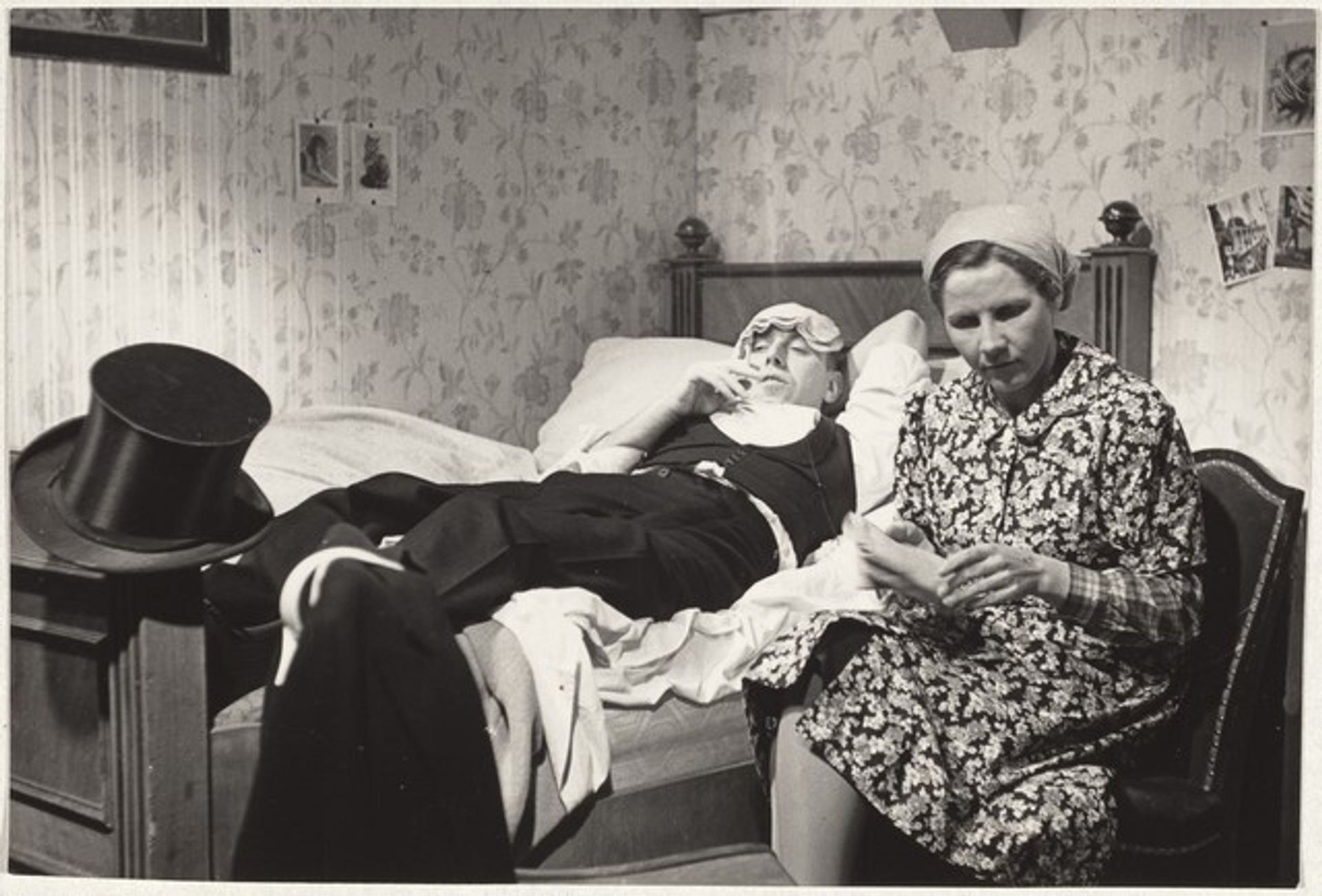 Woman at man's bedside--Filming by Robert Frank