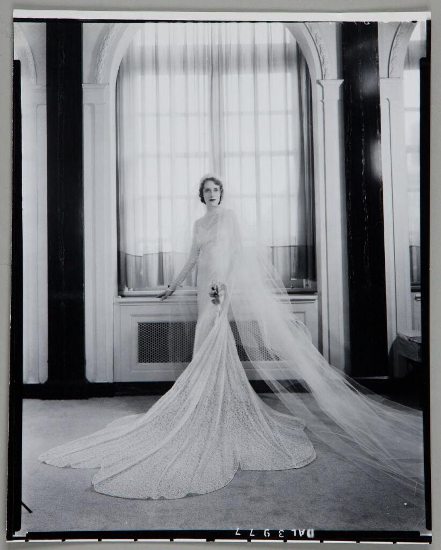Untitled (full length bridal portrait in front of window and radiator) by Paul Gittings