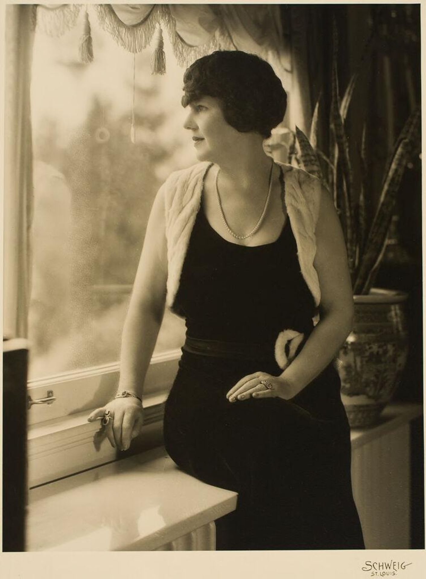 Untitled (woman seated in window) by Martin Schweig