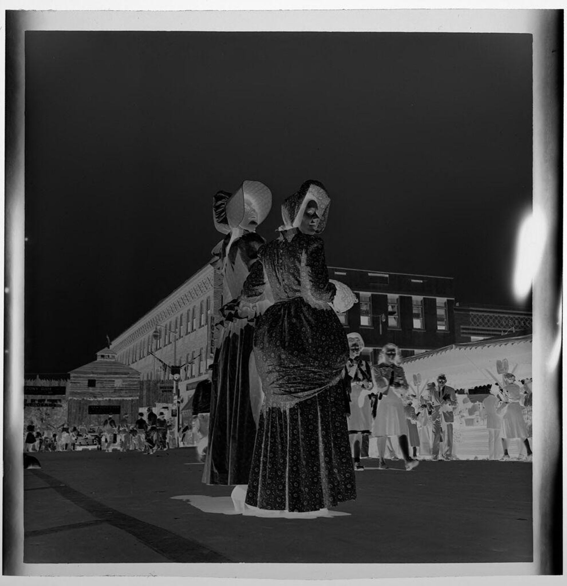 Untitled (two women in frontier dresses at outdoor party) by Jack Gould