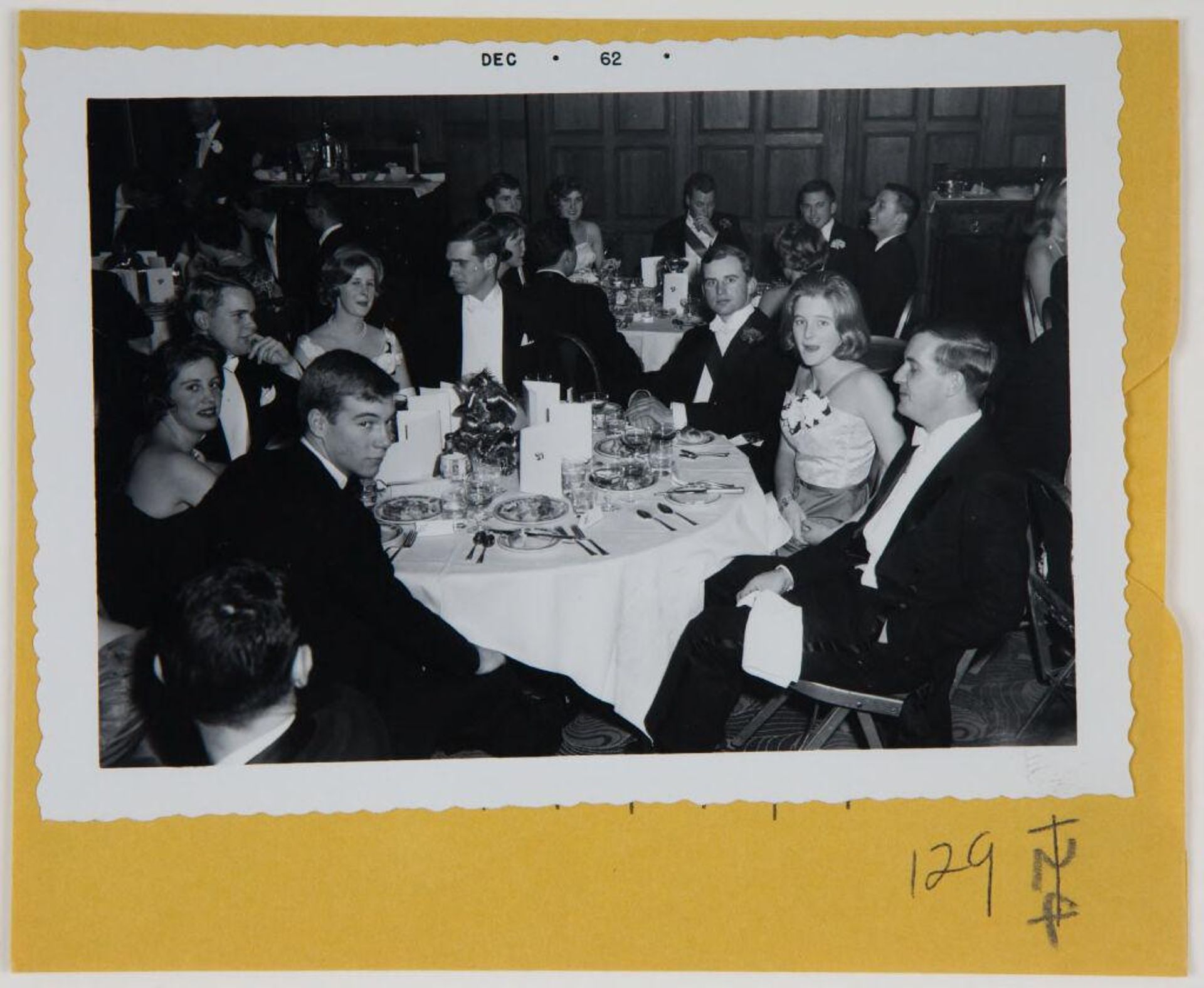 Untitled (young men and women at tables at ball ) by Robert Burian