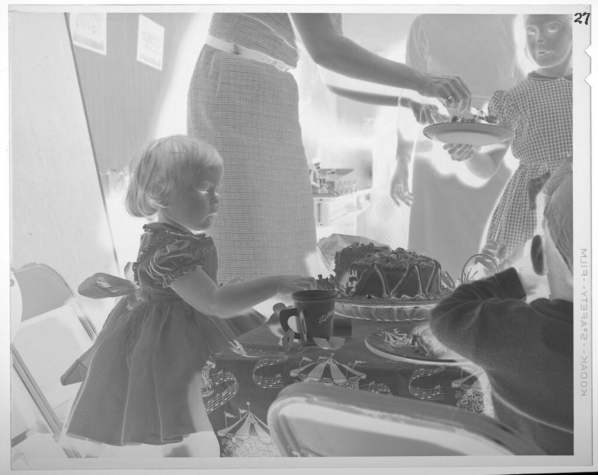 Untitled (little girl eating birthday cake) by Lucian and Mary Brown
