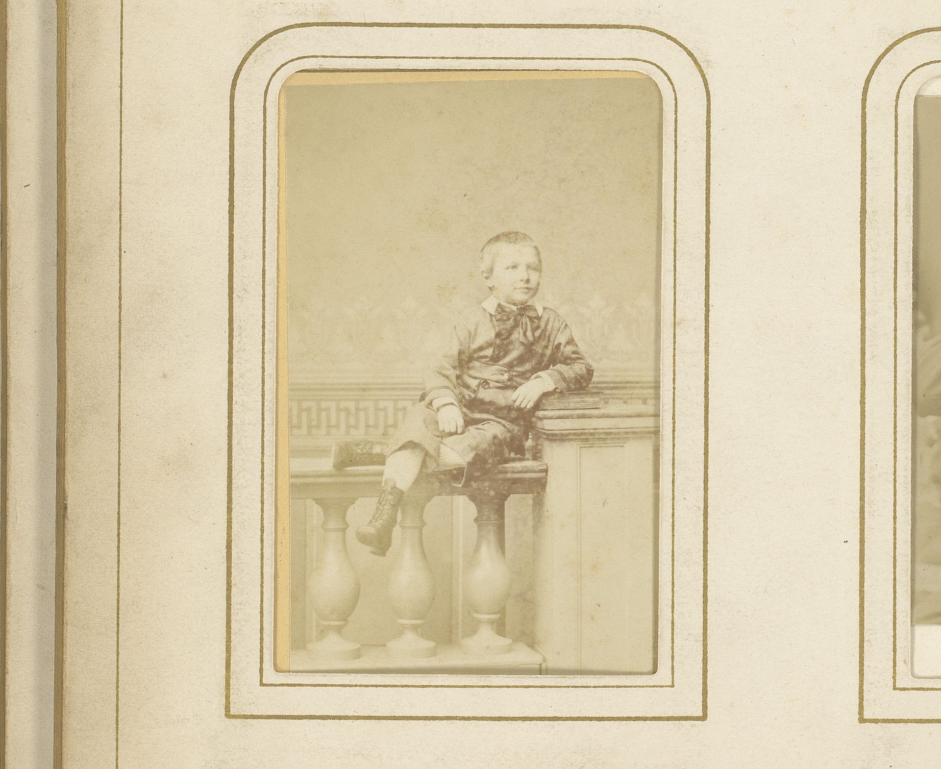 Portret van een jongen, zittend op een balustrade by Eugene Guérin