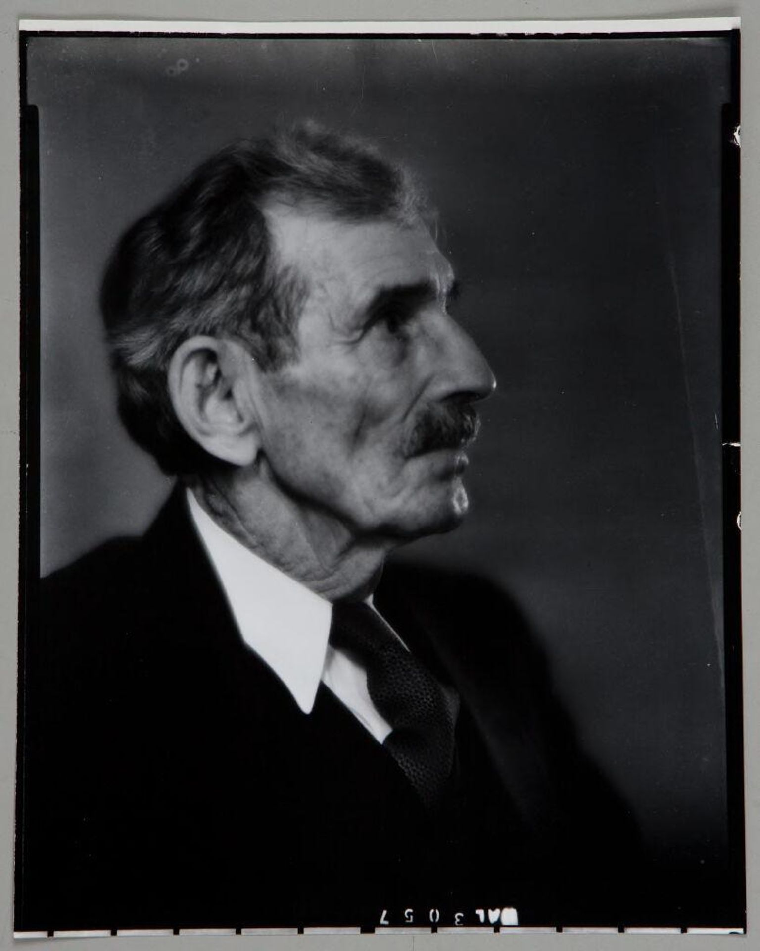 Untitled (portrait of older man wearing suit, in profile) by Paul Gittings