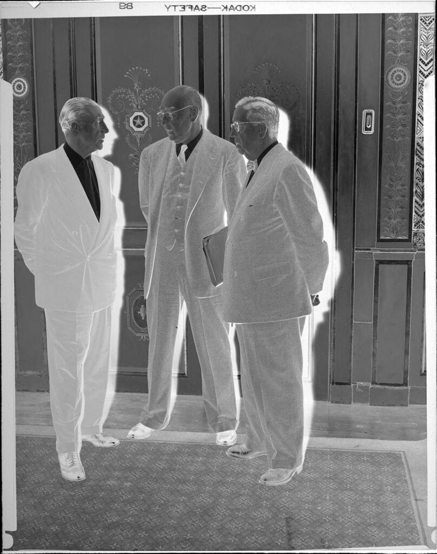 Untitled (three men standing) by Peter James Studio