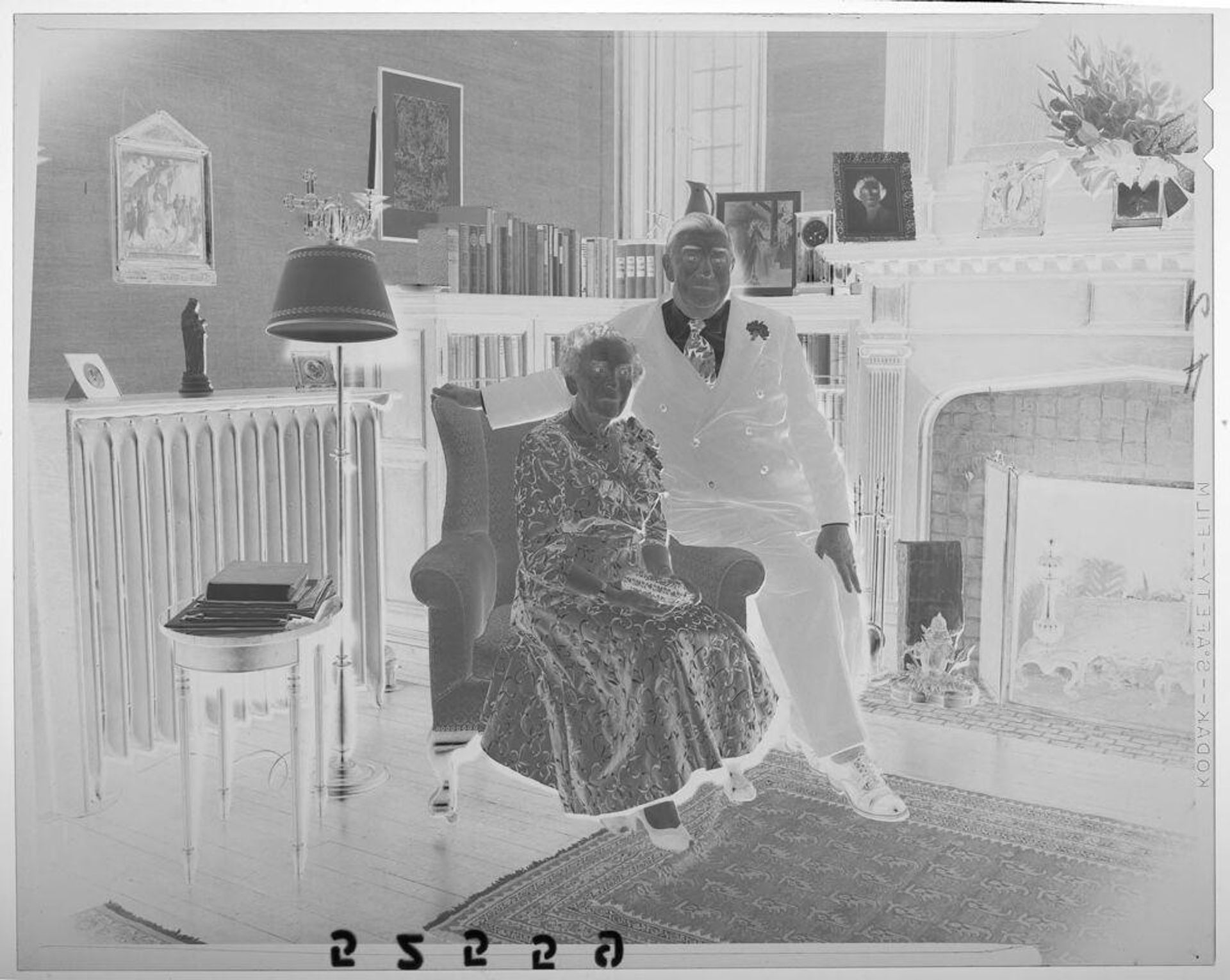 Untitled (old couple posing together in living room for golden wedding anniversary occasion) by Martin Schweig