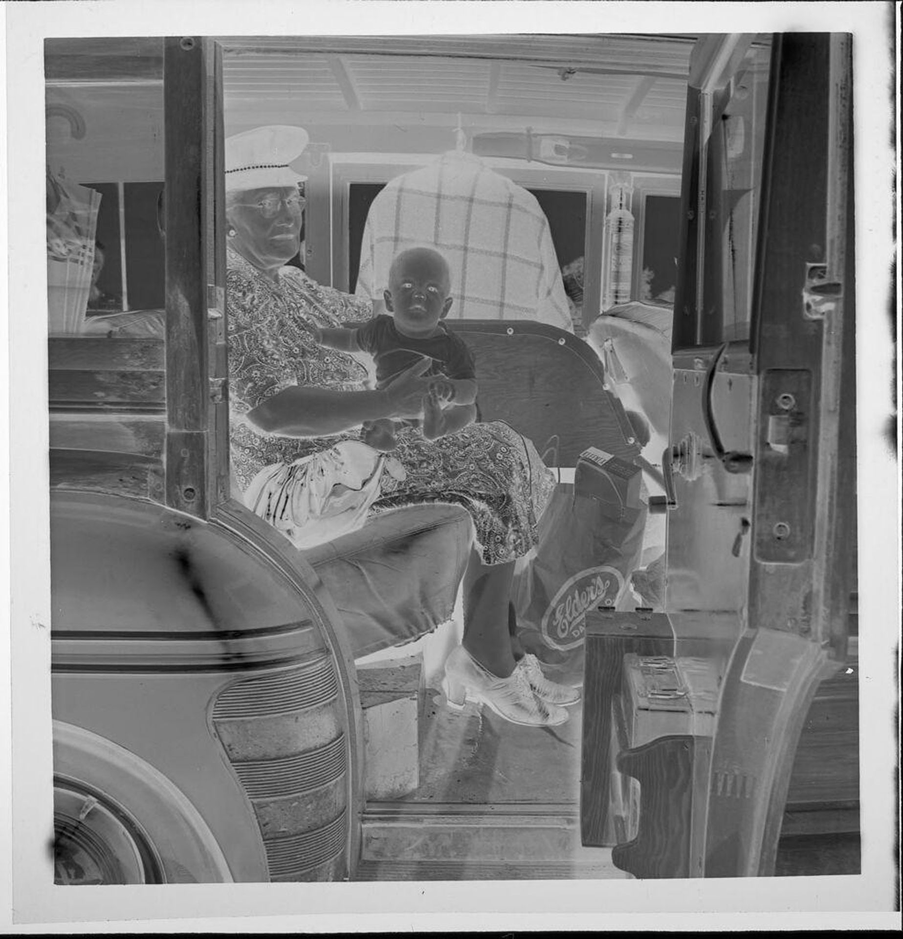 Untitled (elderly woman in sailor hat holding baby) by Jack Gould
