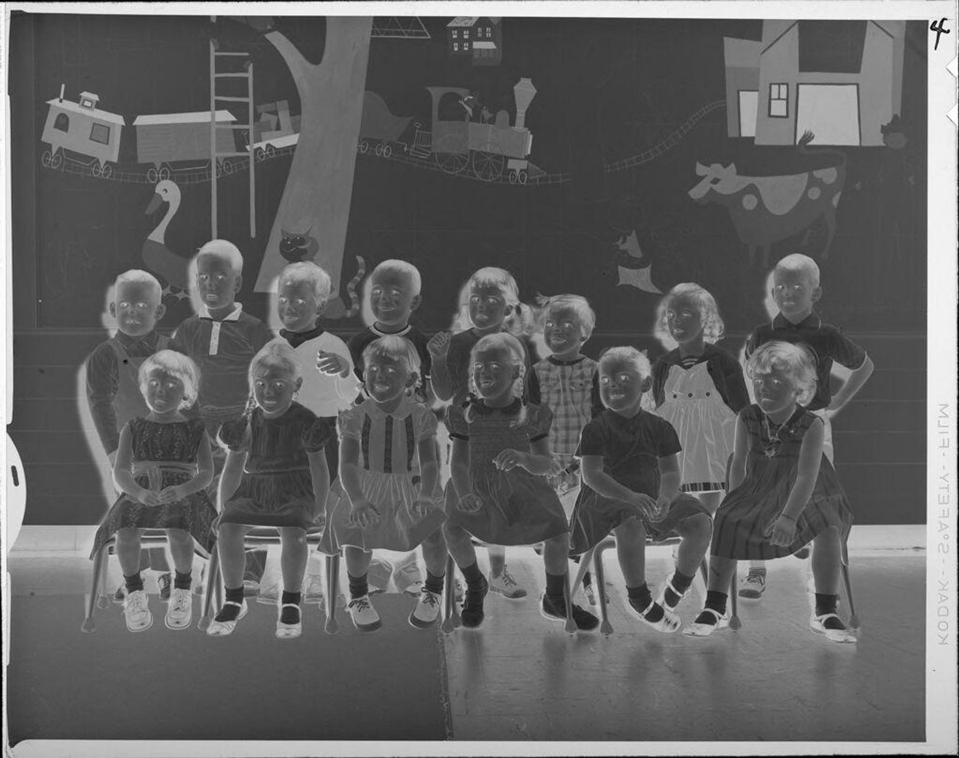Untitled (small children group photo, possibly a class photo in classroom) by Lucian and Mary Brown