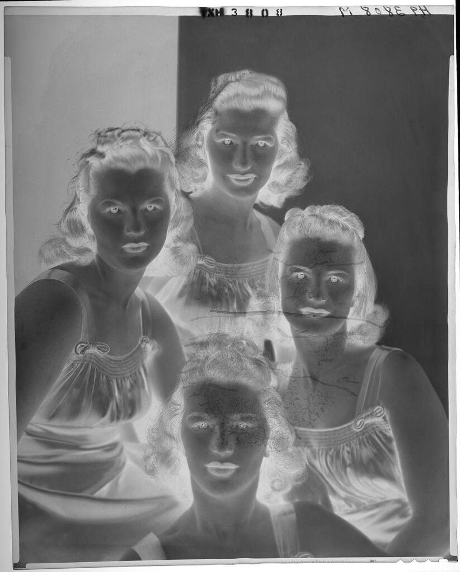 Untitled (studio portrait of four people in matching dresses) by Paul Gittings