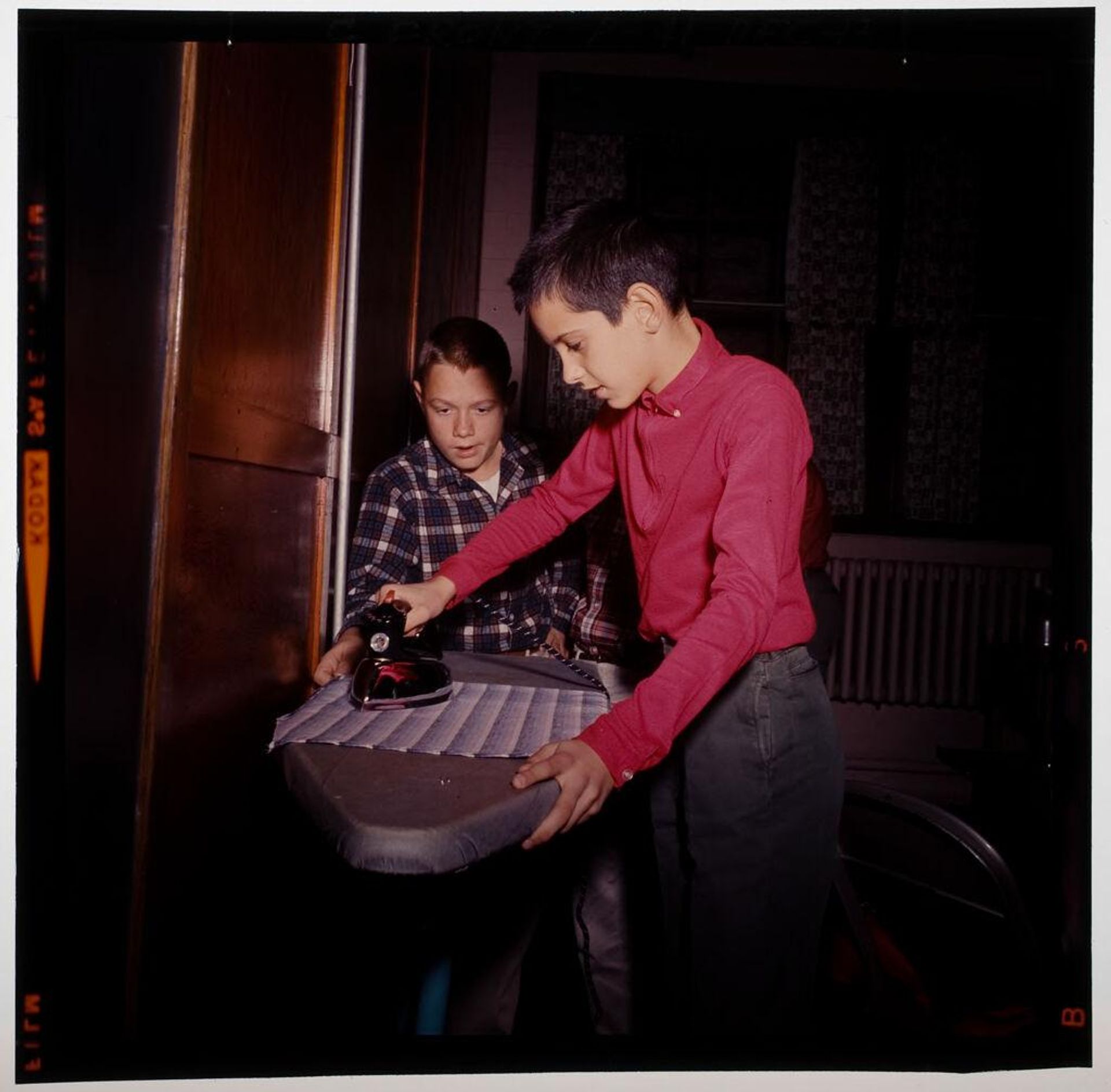 Untitled (two boys ironing) by Jack Gould