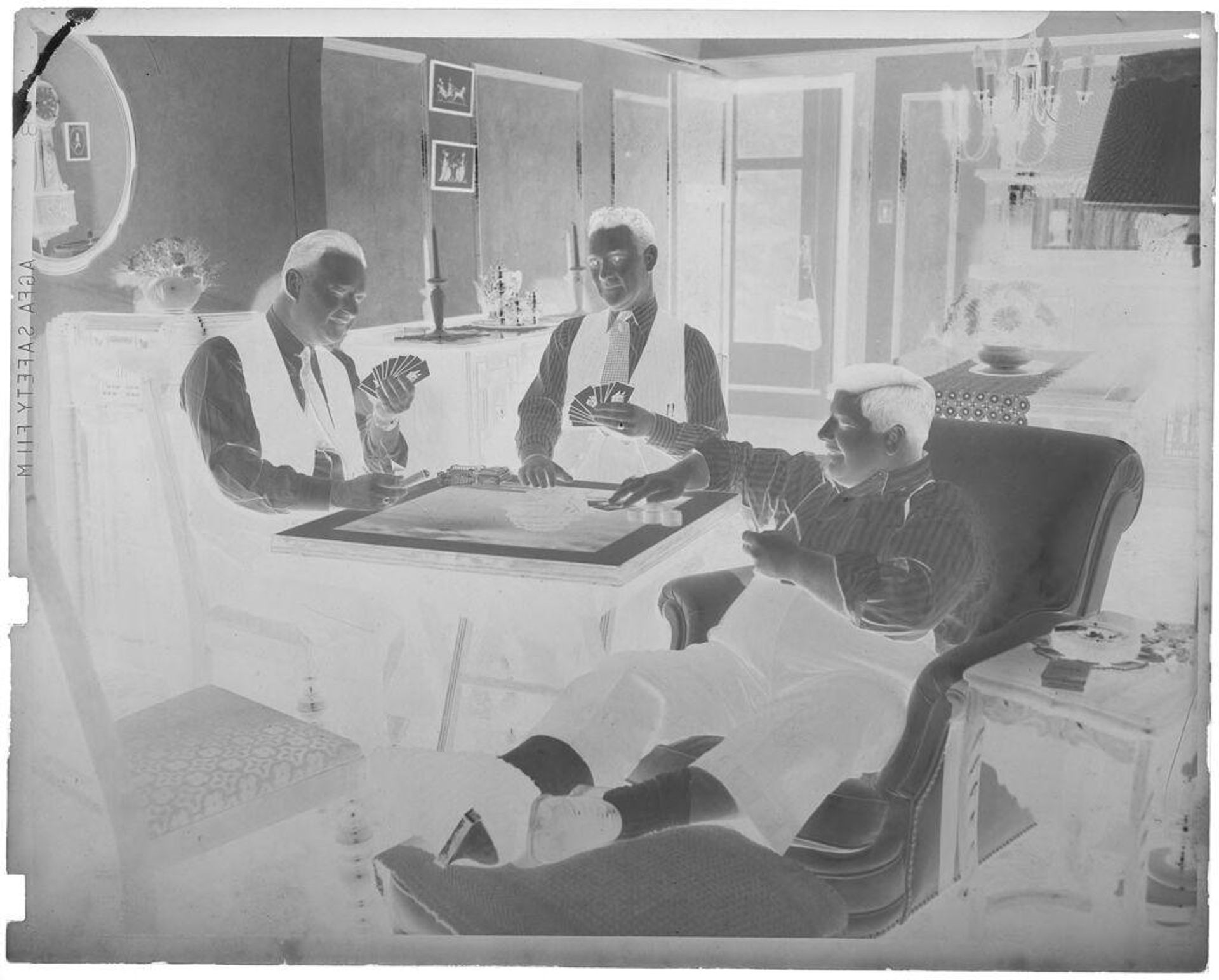 Untitled (three men playing cards) by John Deusing