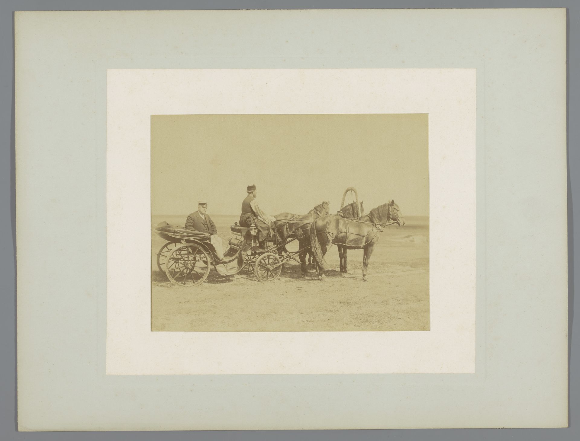 Onbekende man met koetsier in een met paarden bespannen rijtuig by Alexis Mazourine