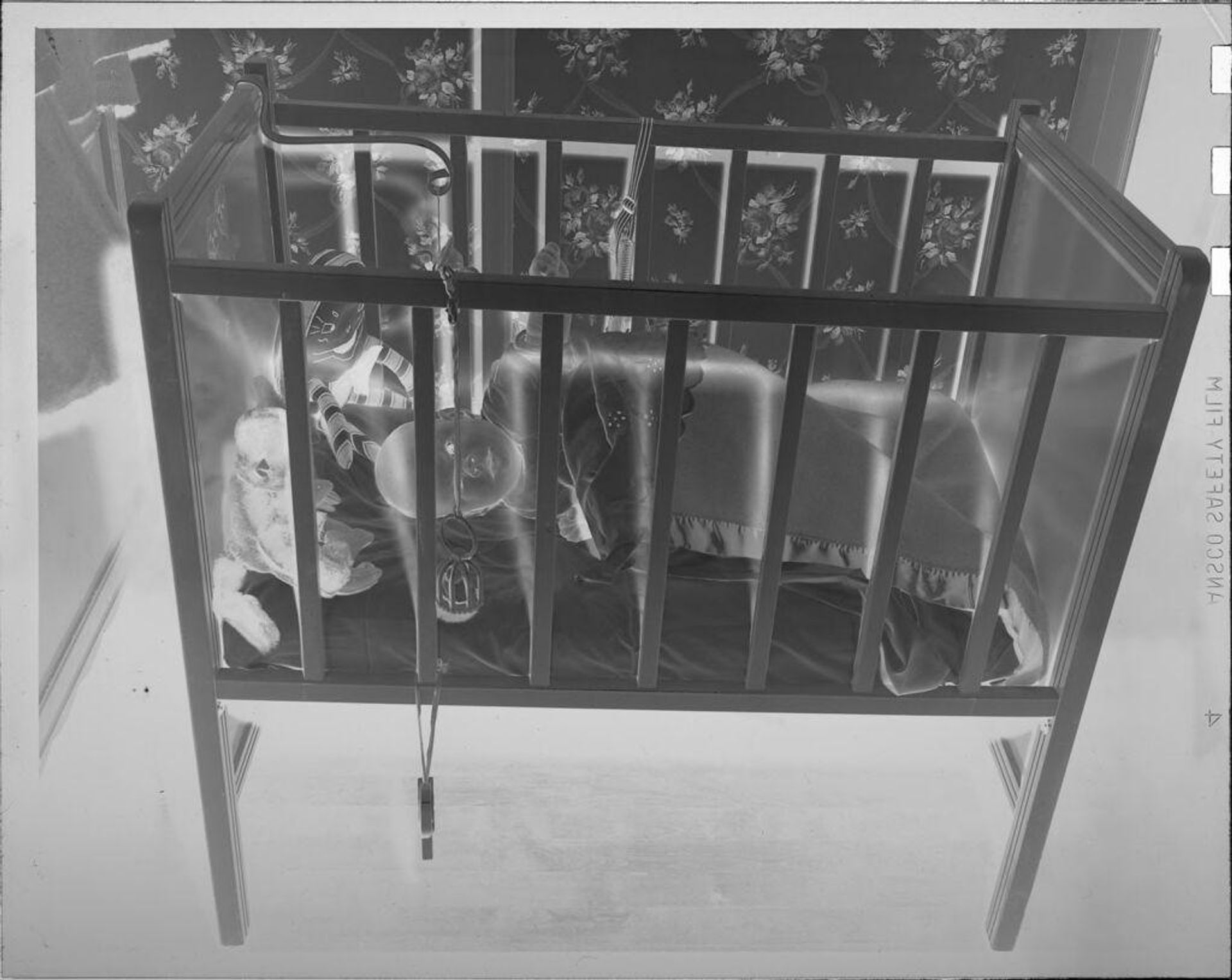 Untitled (baby in crib) by Lucian and Mary Brown