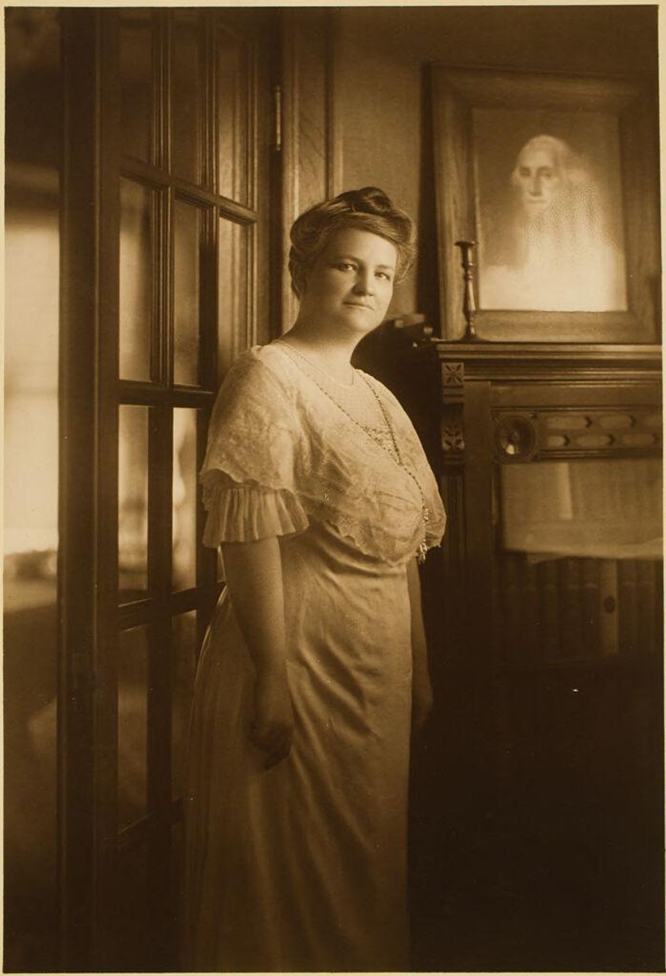 Untitled (woman posed in front of George Washington portrait) by Martin Schweig
