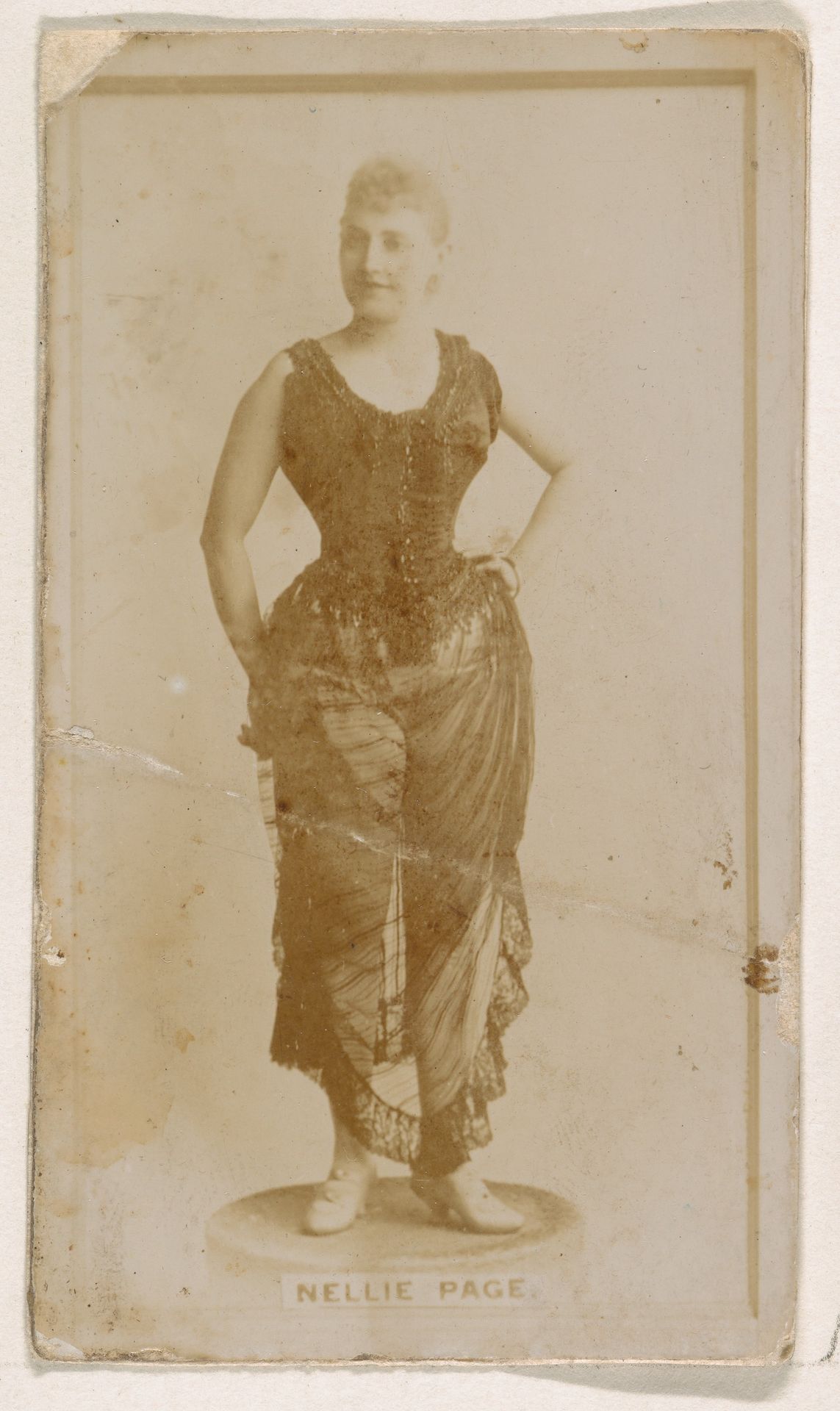 Nellie Page, from the Actresses series (N245) issued by Kinney Brothers to promote Sweet Caporal Cigarettes by Kinney Brothers Tobacco Company