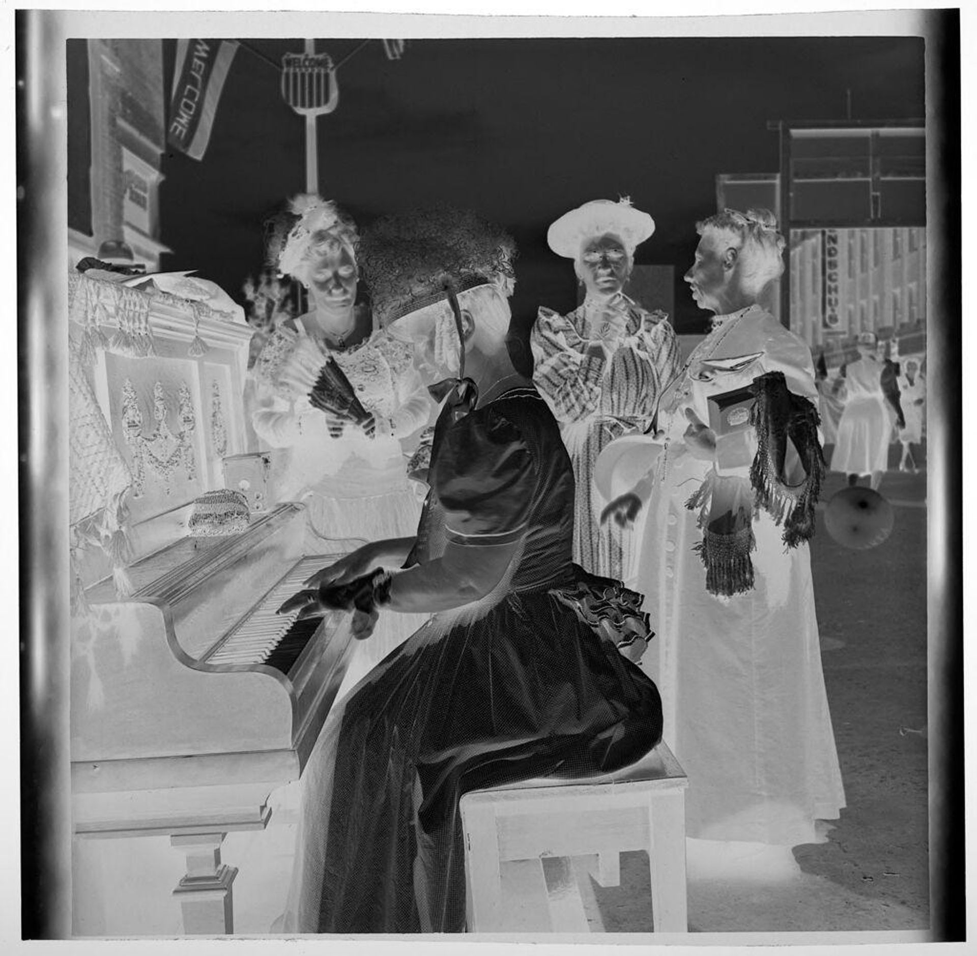 Untitled (woman playing piano at outdoor frontier party) by Jack Gould