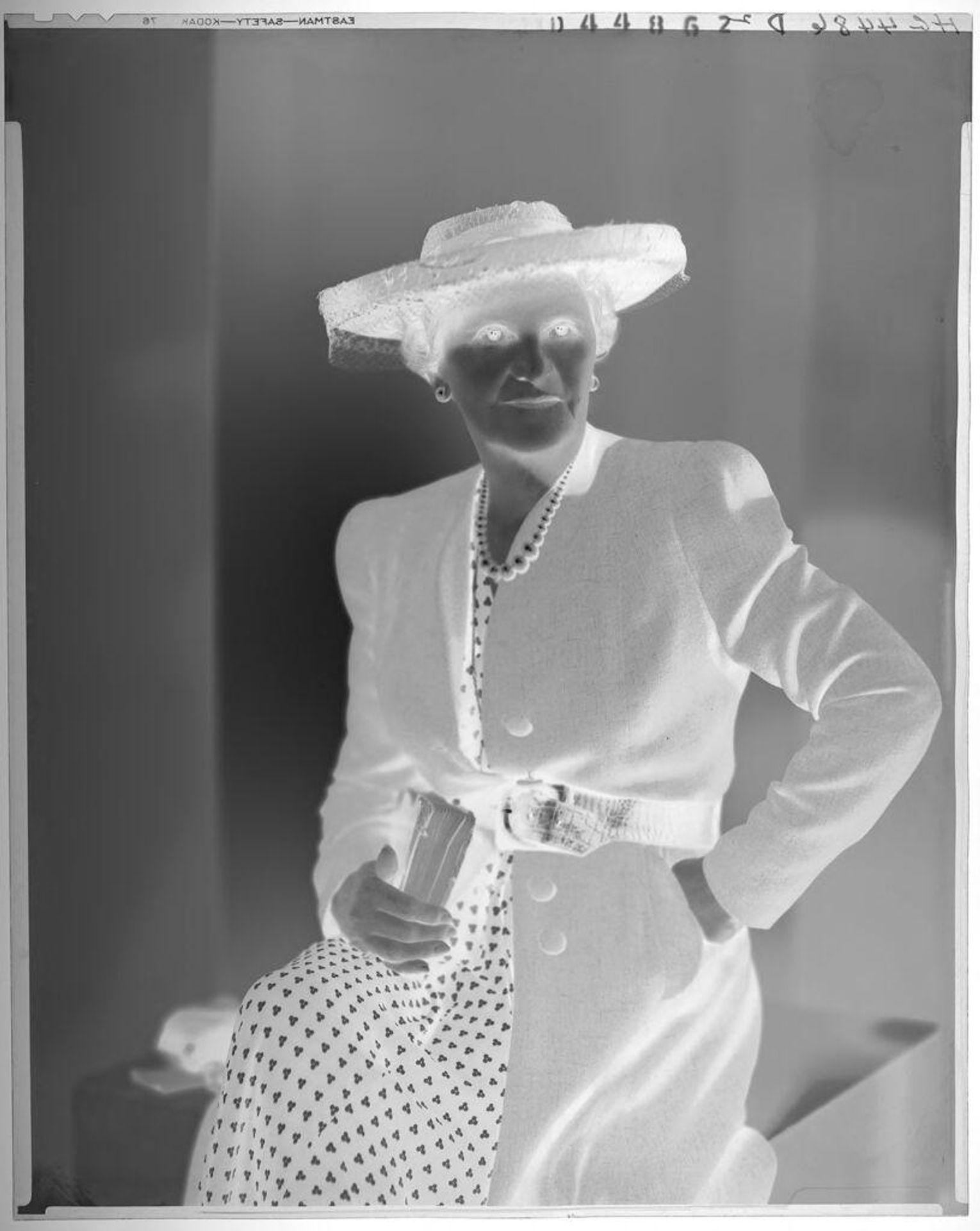 Untitled (portrait of an older woman in hat and earrings, carrying pocketbook) by Paul Gittings