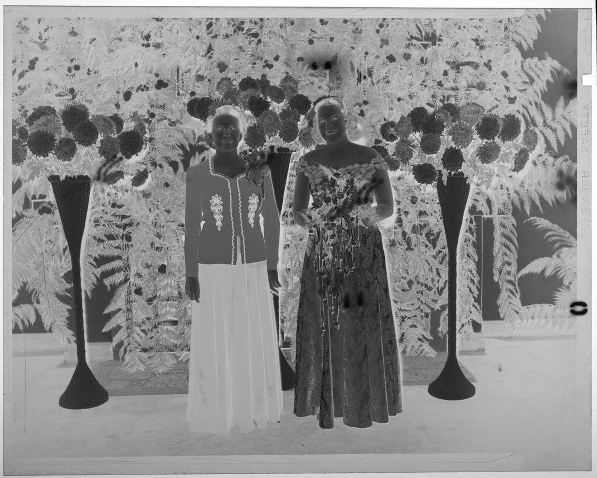 Untitled (young woman with bouquet posed with older woman at altar surrounded by flowers) by Martin Schweig