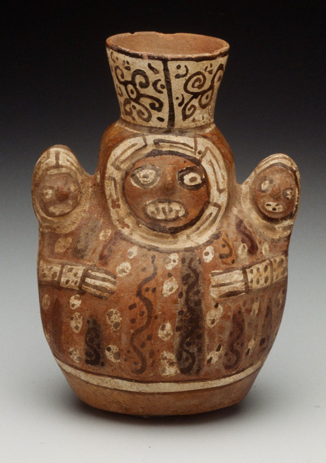 Vase in the shape of a woman holding a child by Tiwanaku
