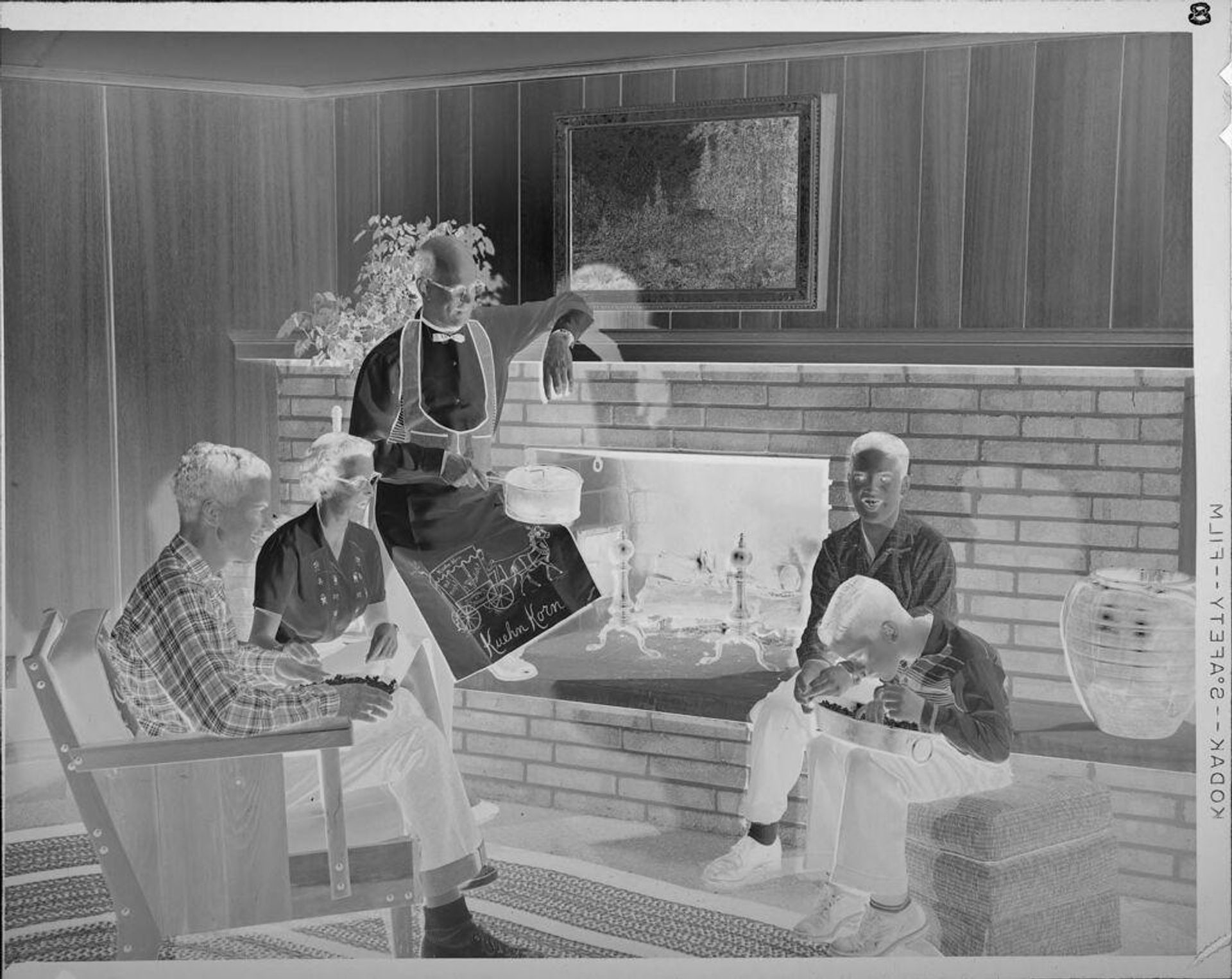 Untitled (family around fireplace) by Lucian and Mary Brown