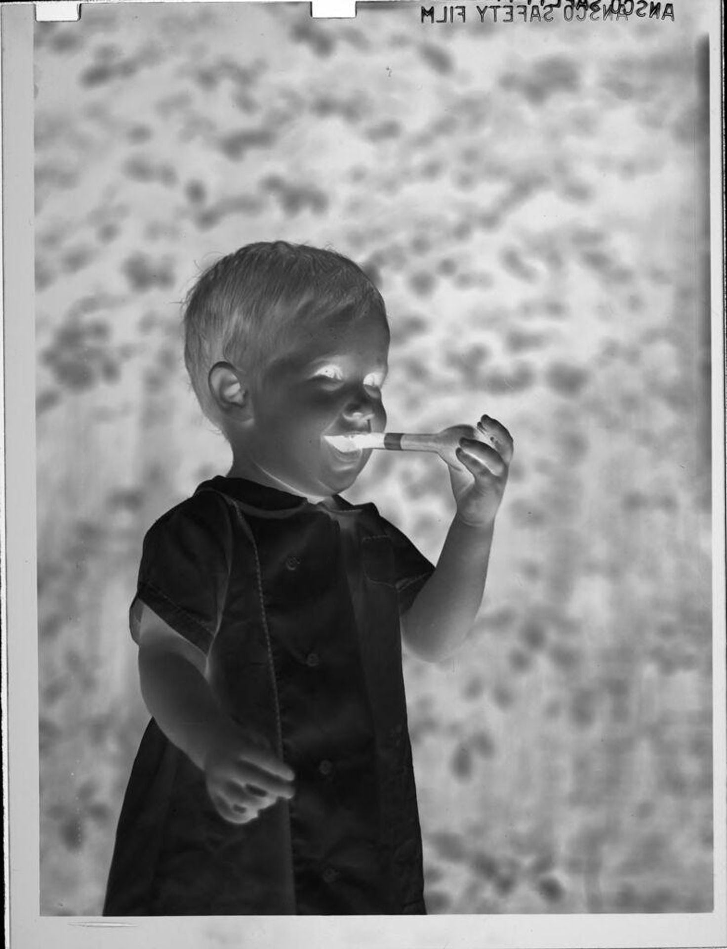 Untitled (little boy holding pipe) by Lucian and Mary Brown