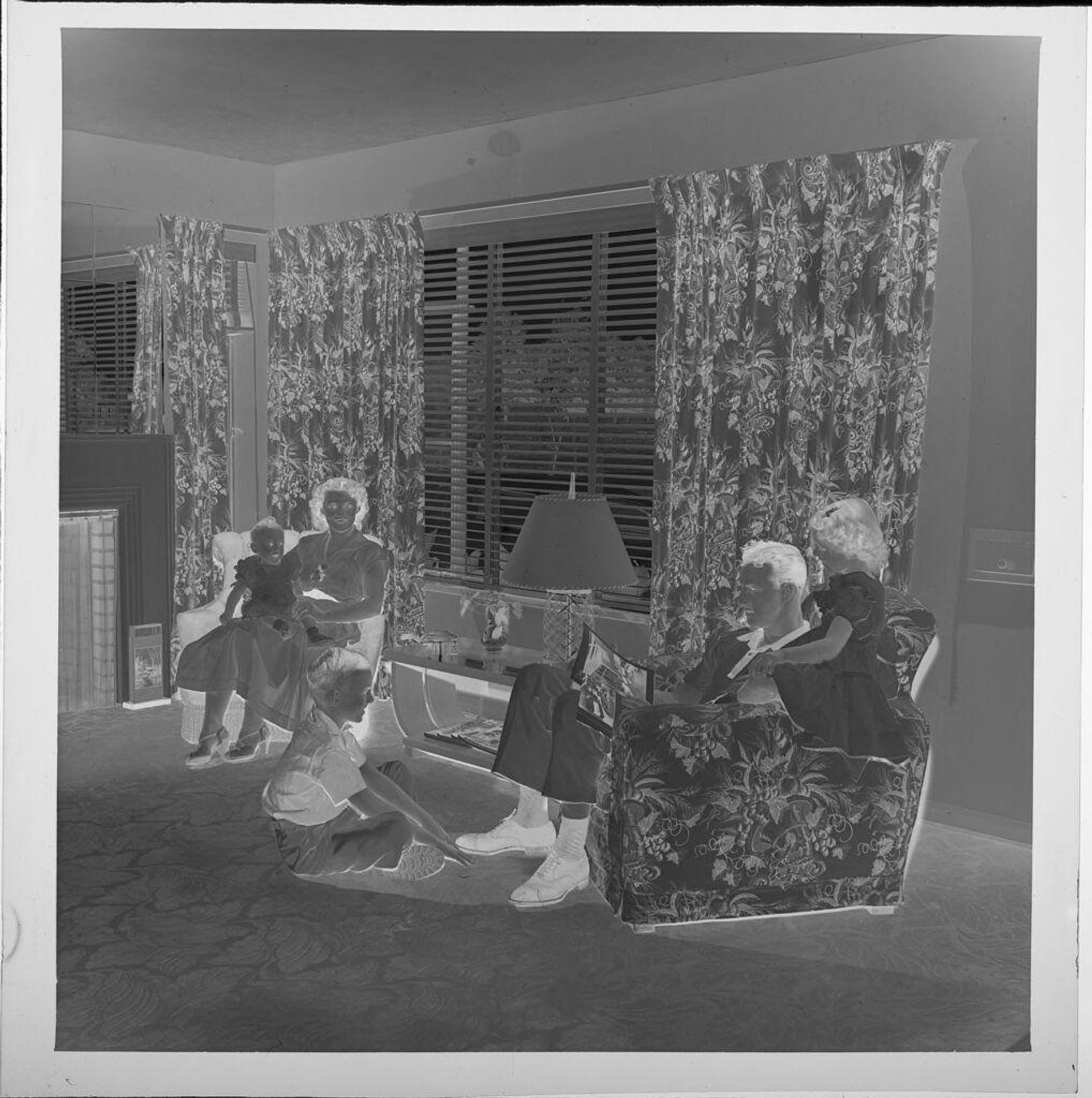Untitled (man, woman, and three children in living room) by Jack Gould