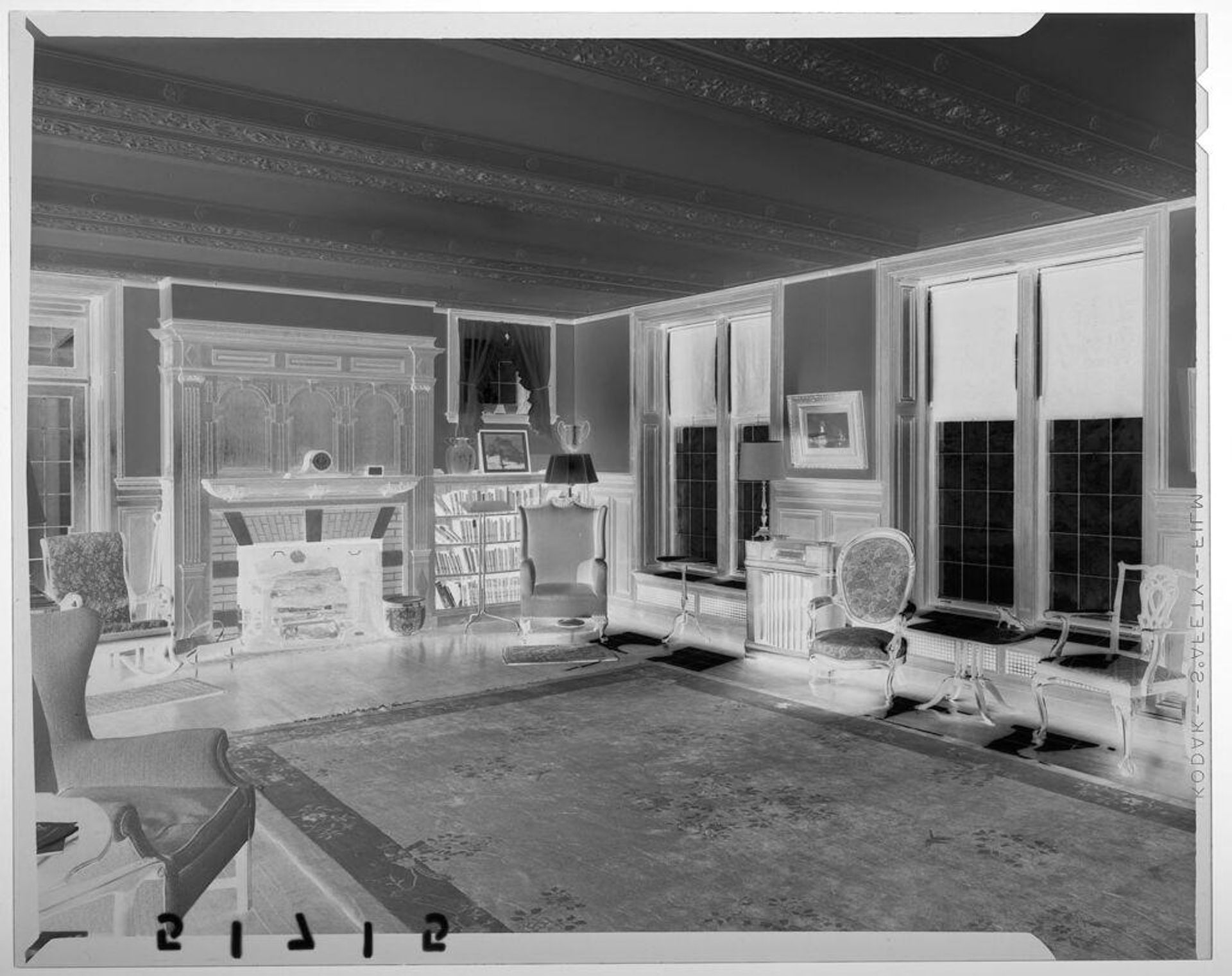 Untitled (interior view of large drawing room with chairs, rug, and fireplace) by Martin Schweig