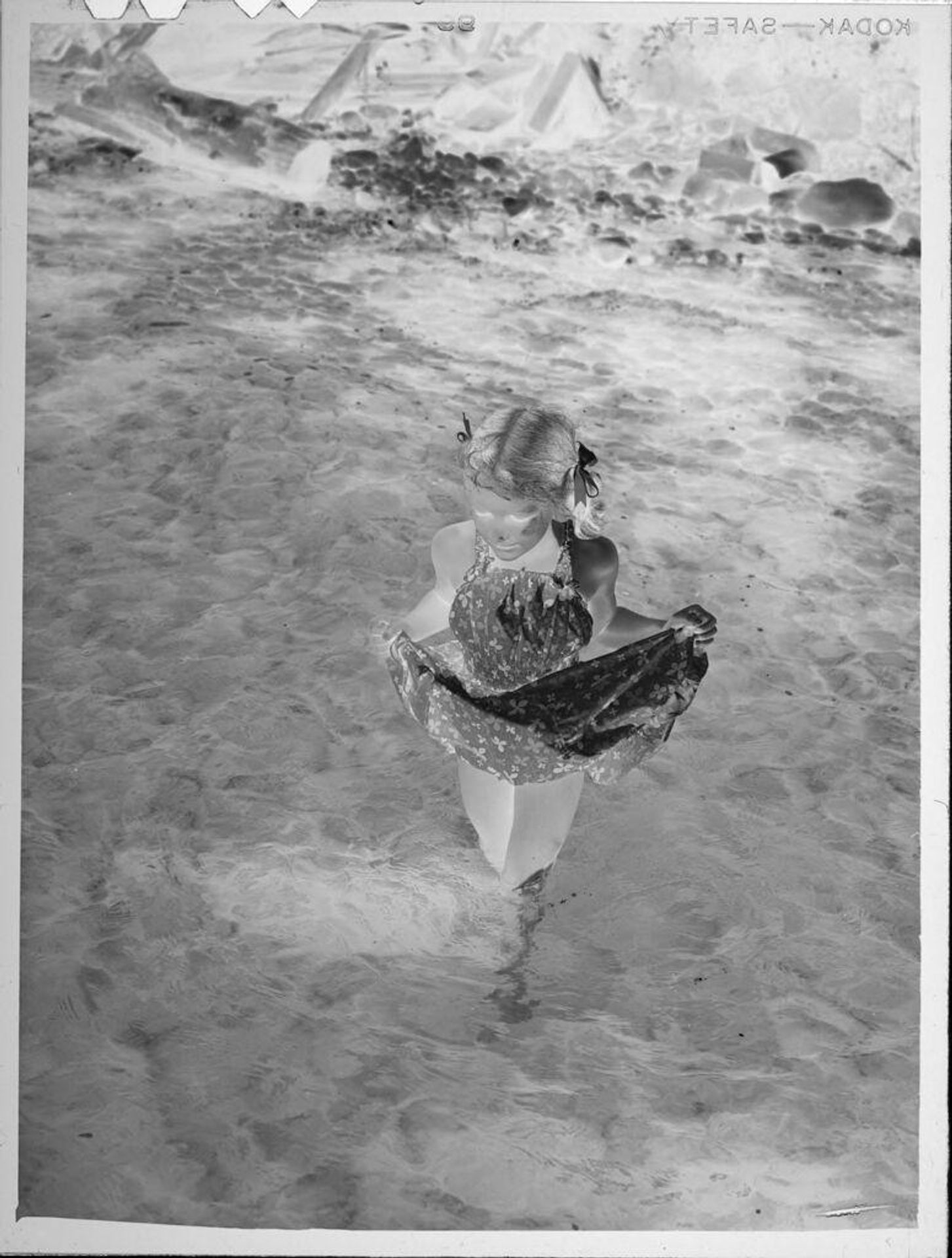 Untitled (girl walking in lake) by Lucian and Mary Brown