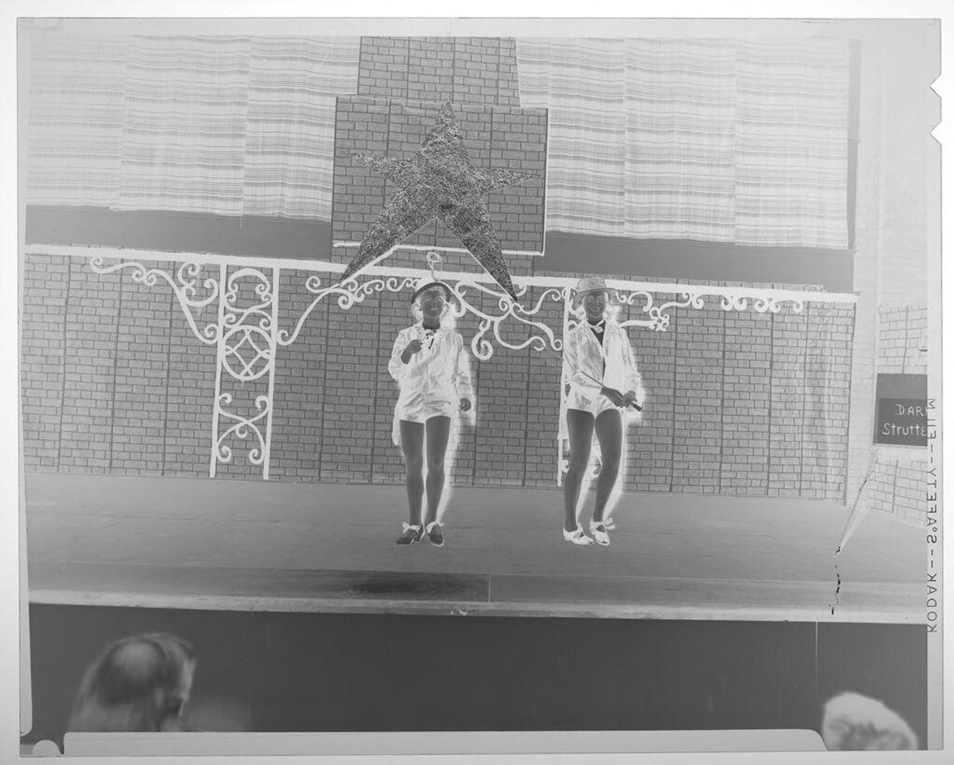 Untitled (two women in costumes tap dancing on stage) by Martin Schweig