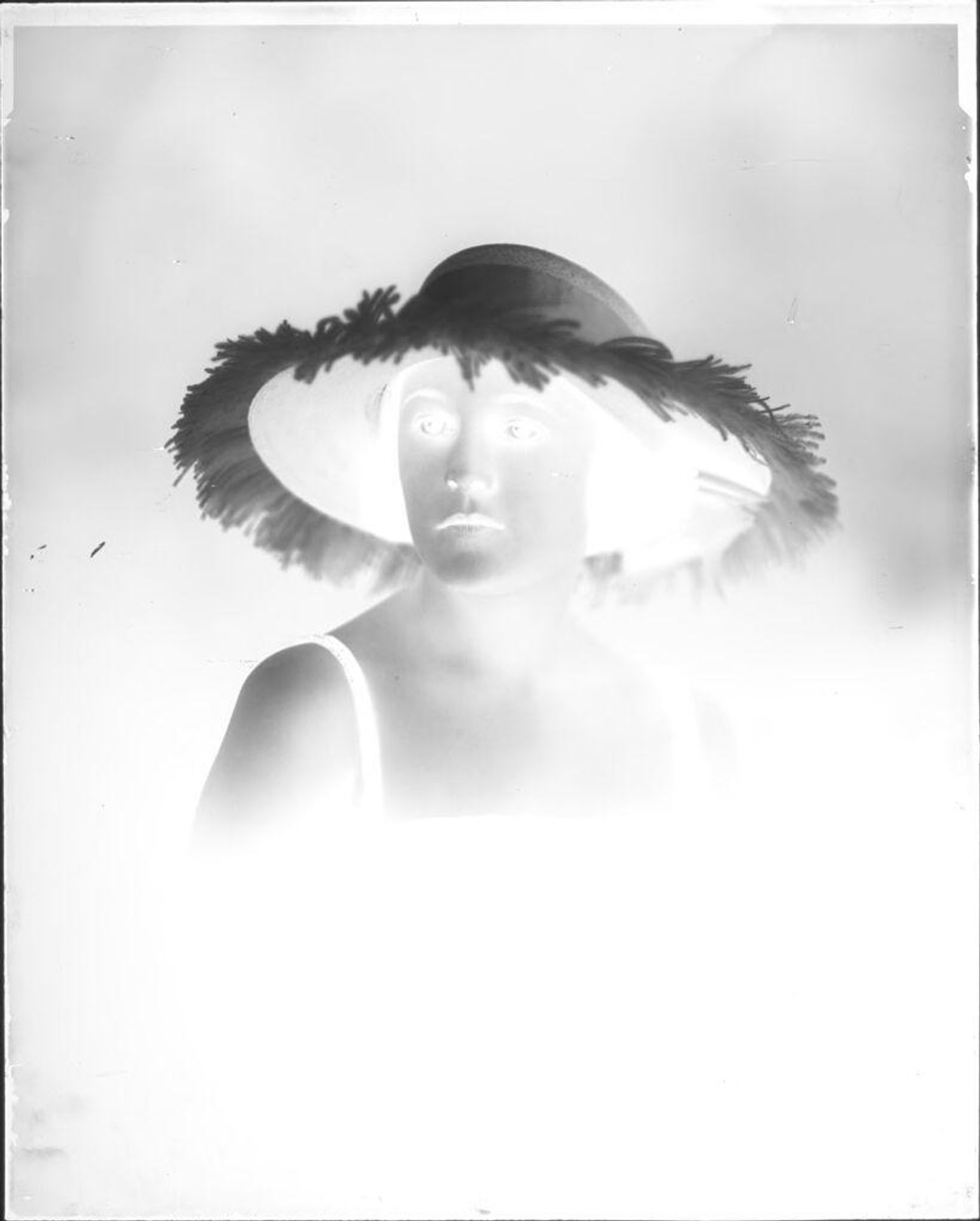 Untitled (portrait of a woman in a large hat and sundress) by Hamblin Studio