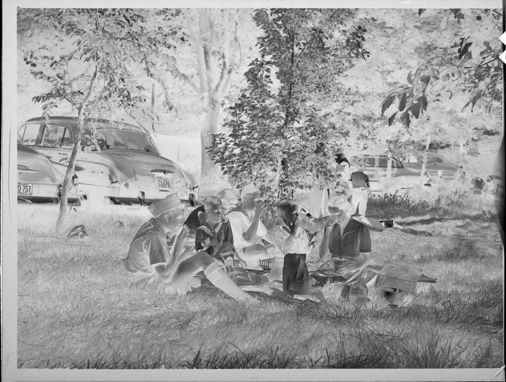 Untitled (family picnic outside) by Lucian and Mary Brown