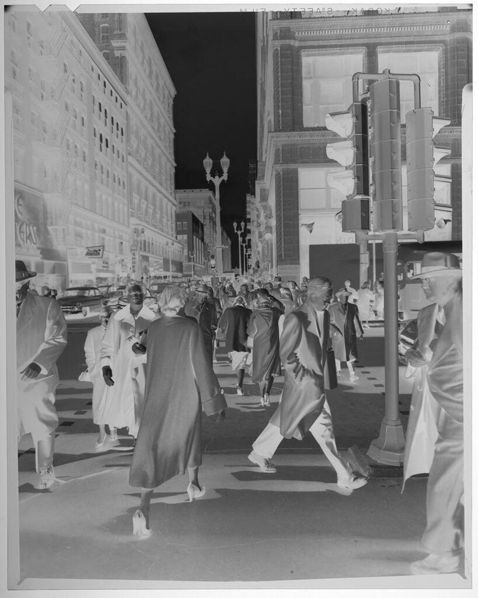 Untitled (crowd of pedestrians walking down city street) by Jack Gould