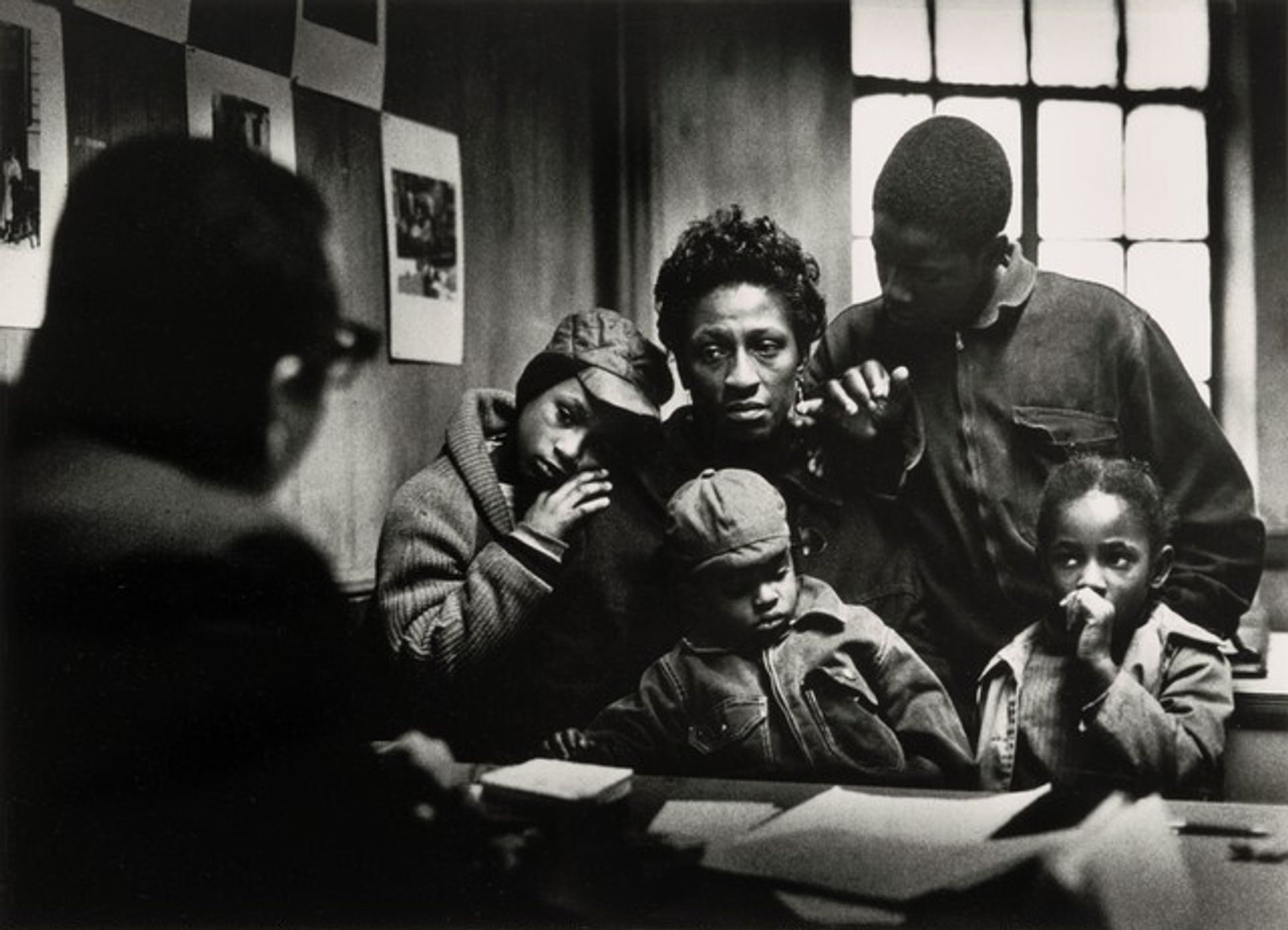 At the Poverty Board: Bessie and Kenneth, Little Richard, Norman Jr., and Ellen by Gordon Parks