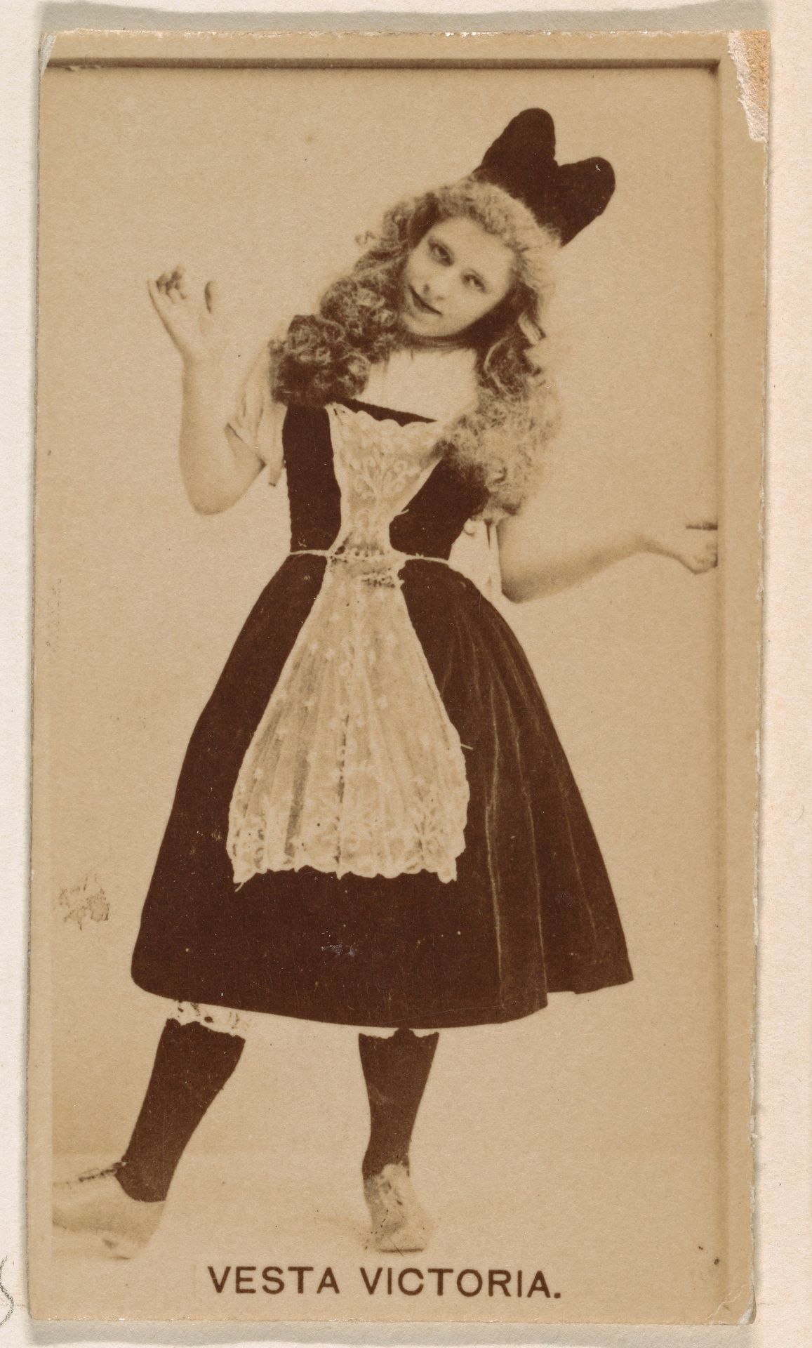 Vesta Victoria, from the Actresses series (N245) issued by Kinney Brothers to promote Sweet Caporal Cigarettes by Kinney Brothers Tobacco Company
