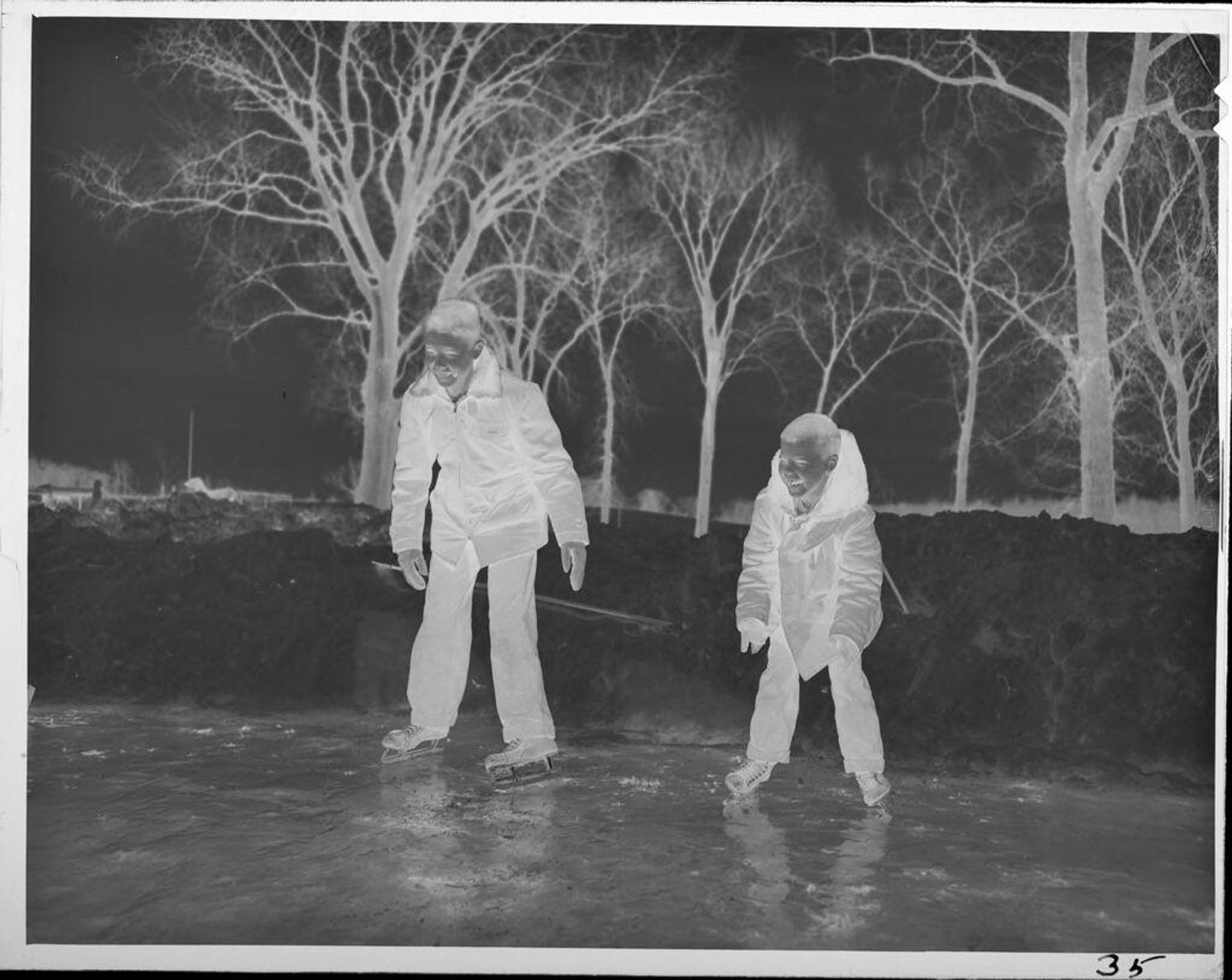 Untitled (two boys ice skating) by Lucian and Mary Brown