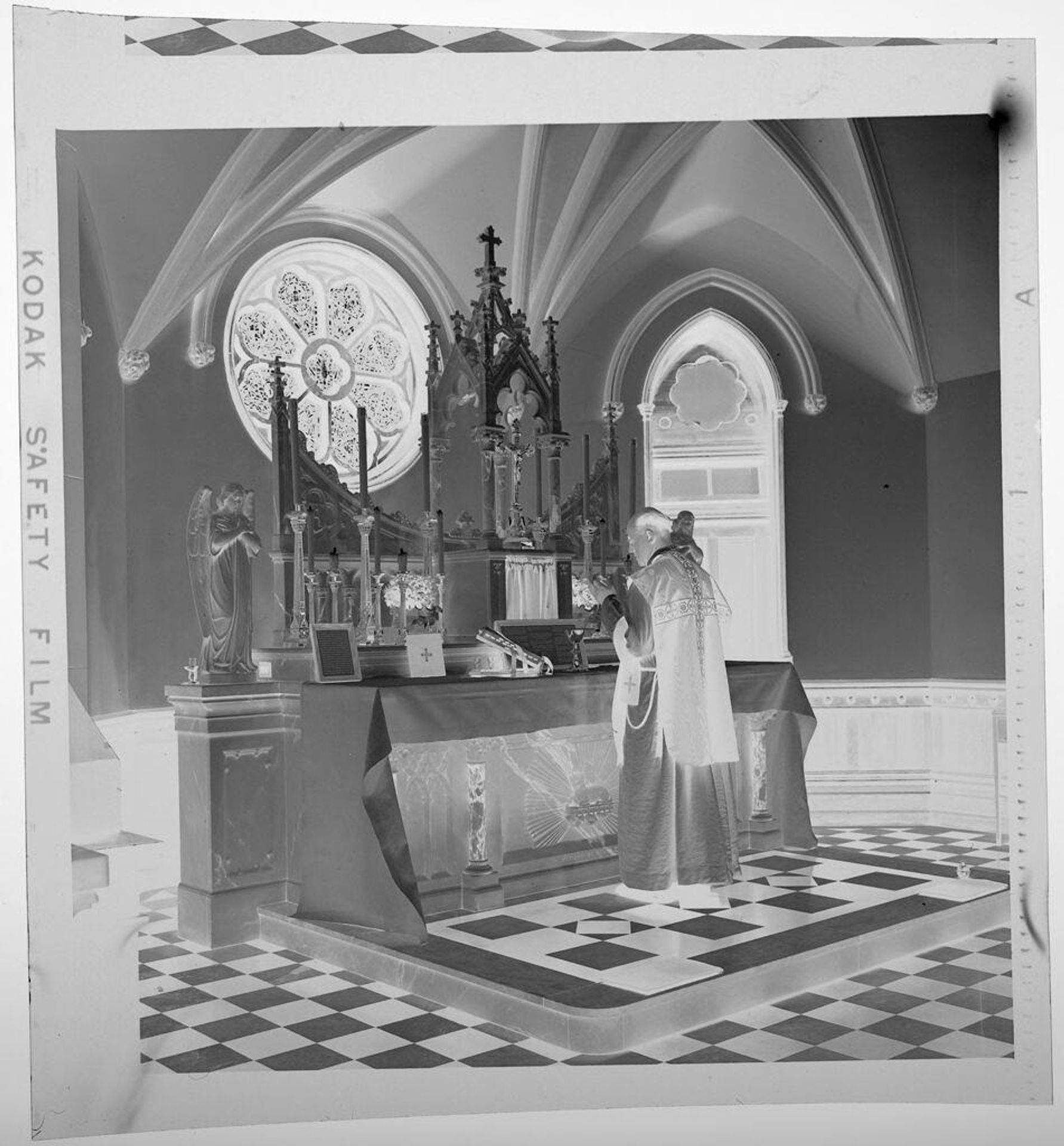 Untitled (priest standing at altar) by Jack Gould