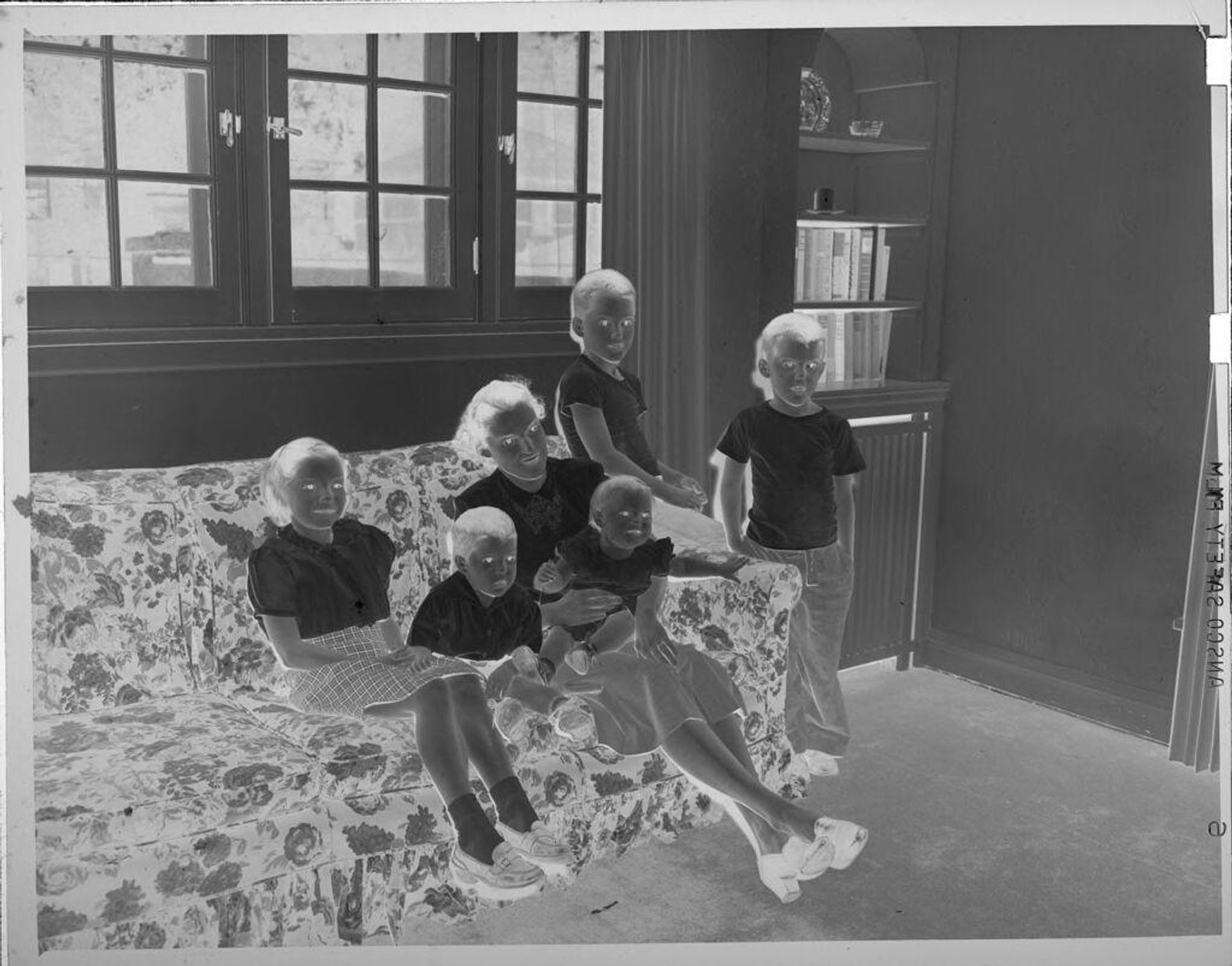 Untitled (group of children on couch) by Lucian and Mary Brown
