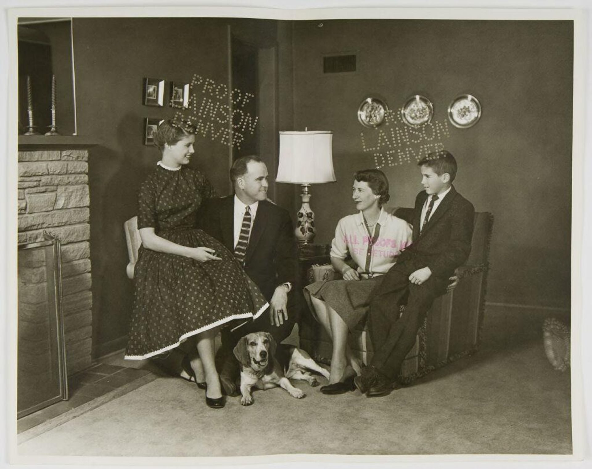 Untitled (family portrait in living room) by Lainson Studios